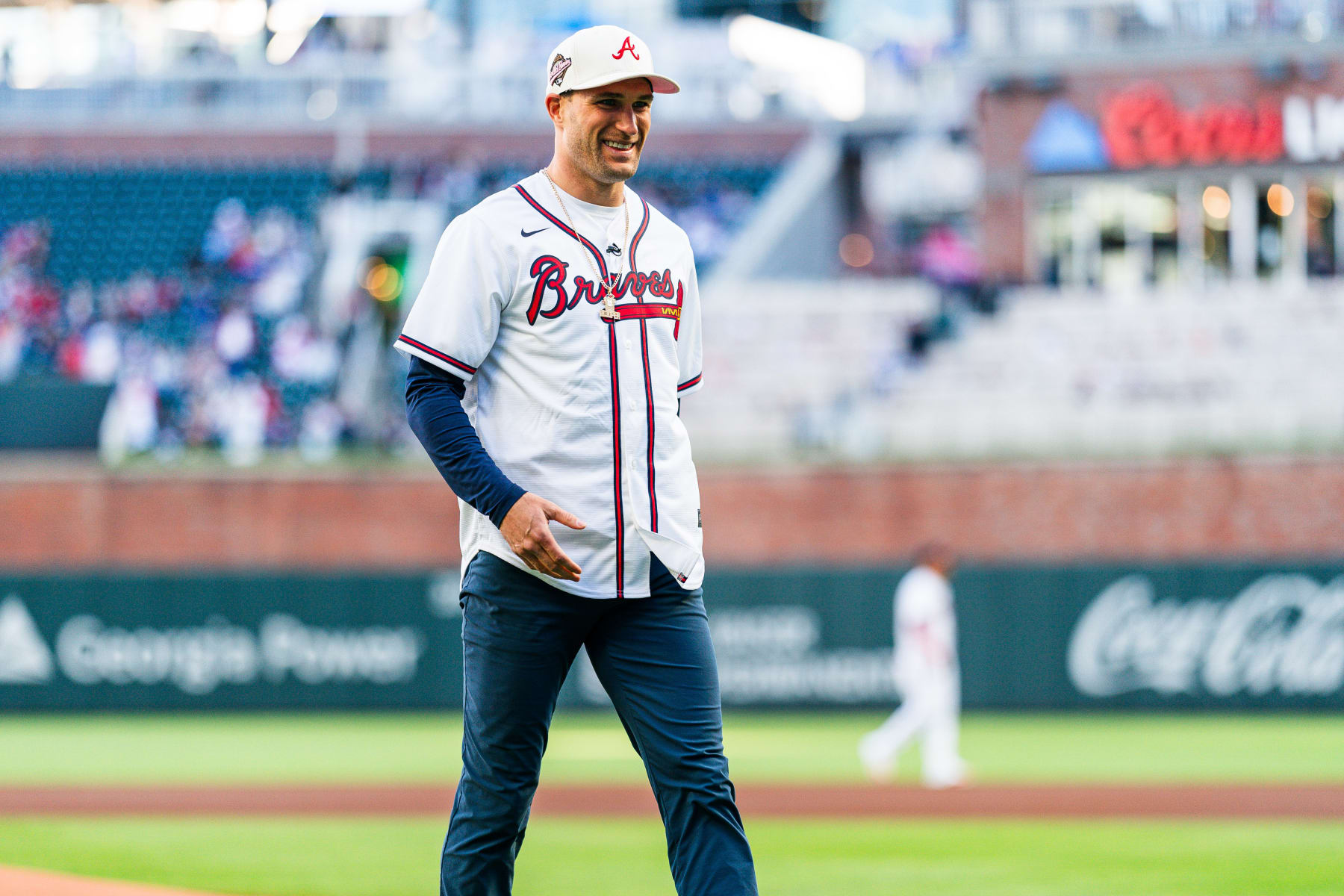 ATLANTA, GA - APRIL 21: Atlanta Falcons quarterback Kirk Cousins throws out the ceremonial first pitch before the game between the Atlanta Braves and the Texas Rangers at Truist Park on April 21, 2024 in Atlanta, Georgia. (Photo by Matthew Grimes Jr./Atlanta Braves/Getty Images)