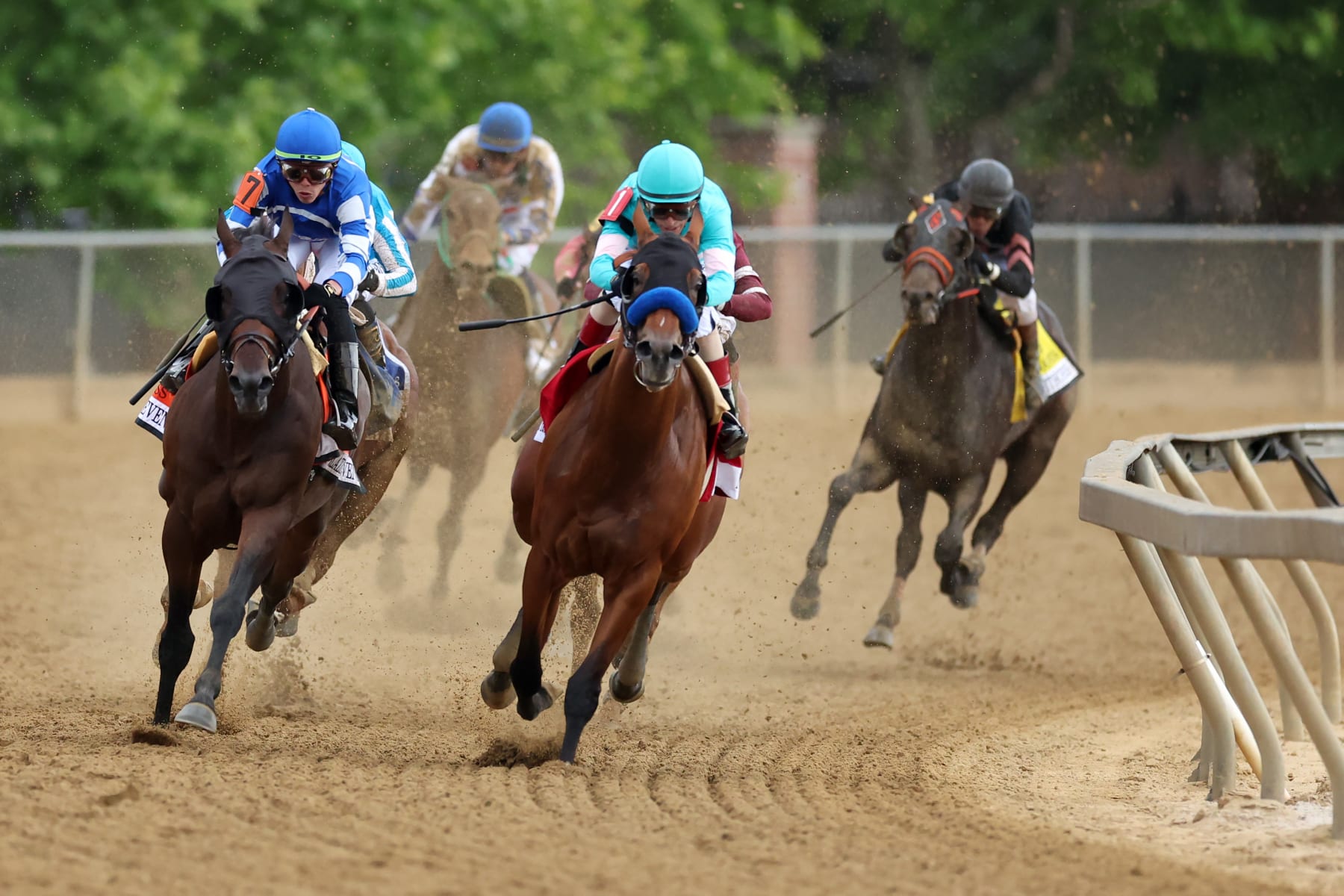 BALTIMORE, MARYLAND - MAY 20: Jockey John Velazquez #1 on  National Treasure (R) and jockey Irad Ortiz Jr. #7 aboard Blazing Sevens come out of the fourth turn during the 148th Running of the Preakness Stakes at Pimlico Race Course on May 20, 2023 in Baltimore, Maryland. (Photo by Rob Carr/Getty Images)