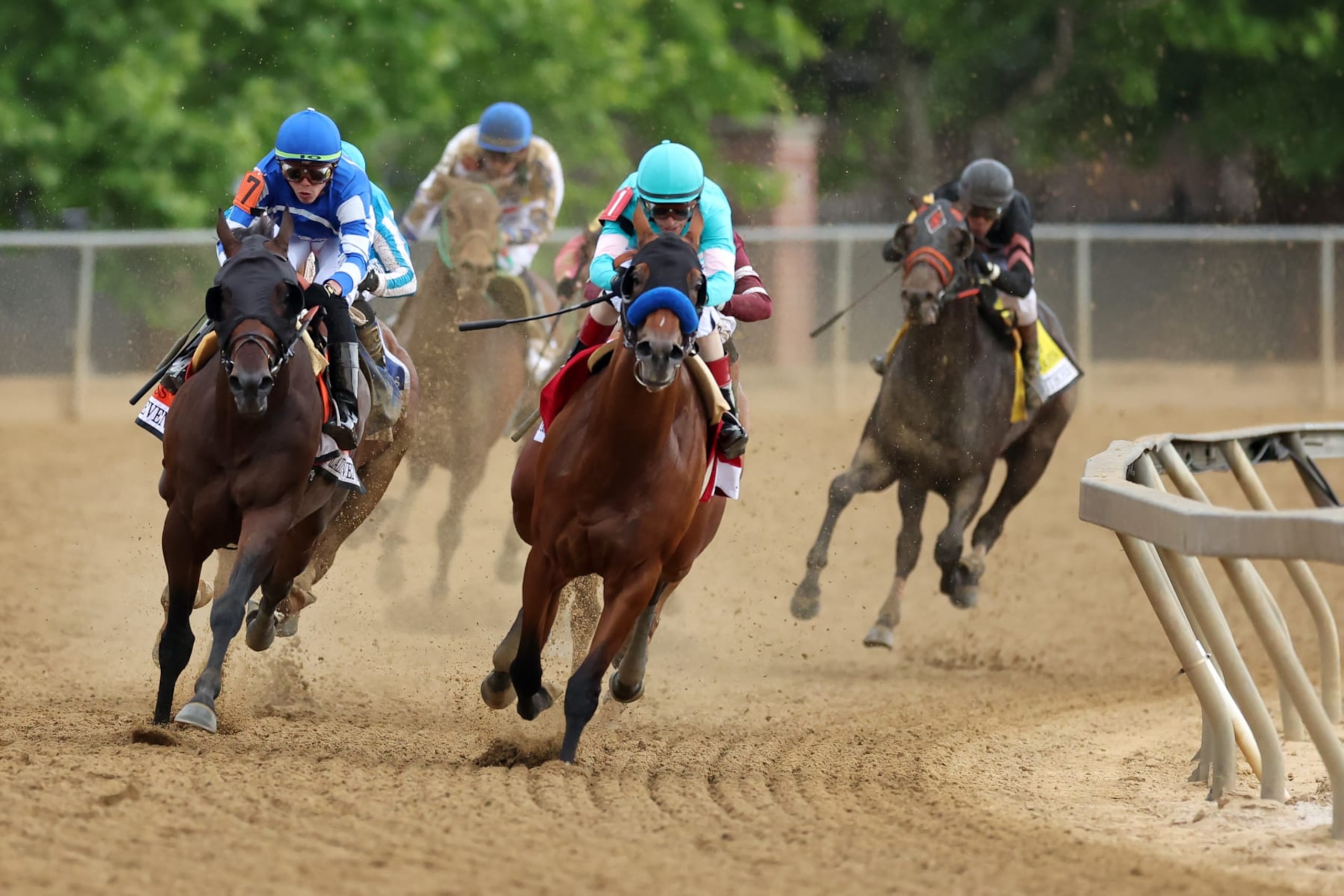 BALTIMORE, MARYLAND - MAY 20: Jockey John Velazquez #1 on  National Treasure (R) and jockey Irad Ortiz Jr. #7 aboard Blazing Sevens come out of the fourth turn during the 148th Running of the Preakness Stakes at Pimlico Race Course on May 20, 2023 in Baltimore, Maryland. (Photo by Rob Carr/Getty Images)