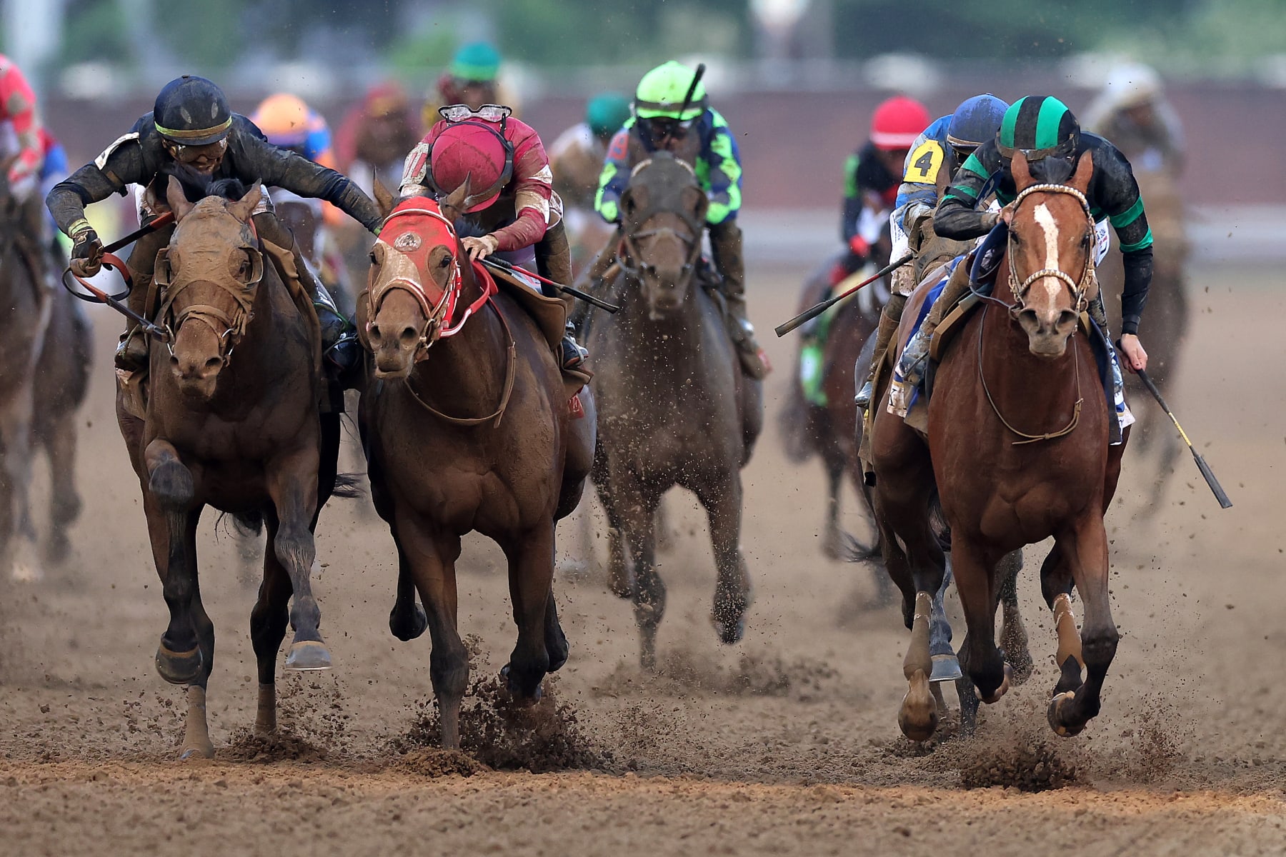 LOUISVILLE, KENTUCKY - MAY 04: Mystik Dan #3, ridden by jockey Brian J. Hernandez Jr. crosses the finish line ahead of Sierra Leone #2, ridden by jockey Tyler Gaffalione and Forever Young, ridden by jockey Ryusei Sakai to win the 150th running of the Kentucky Derby at Churchill Downs on May 04, 2024 in Louisville, Kentucky. (Photo by Rob Carr/Getty Images)
