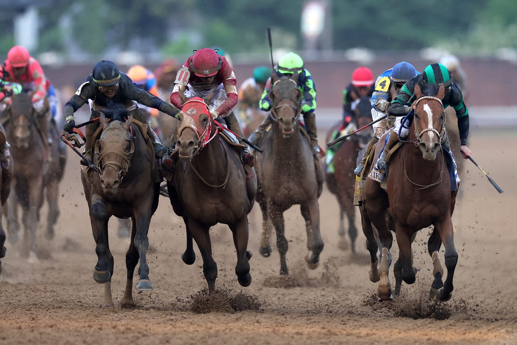 LOUISVILLE, KENTUCKY - MAY 04: Mystik Dan #3, ridden by jockey Brian J. Hernandez Jr. crosses the finish line ahead of Sierra Leone #2, ridden by jockey Tyler Gaffalione and Forever Young, ridden by jockey Ryusei Sakai to win the 150th running of the Kentucky Derby at Churchill Downs on May 04, 2024 in Louisville, Kentucky. (Photo by Rob Carr/Getty Images)