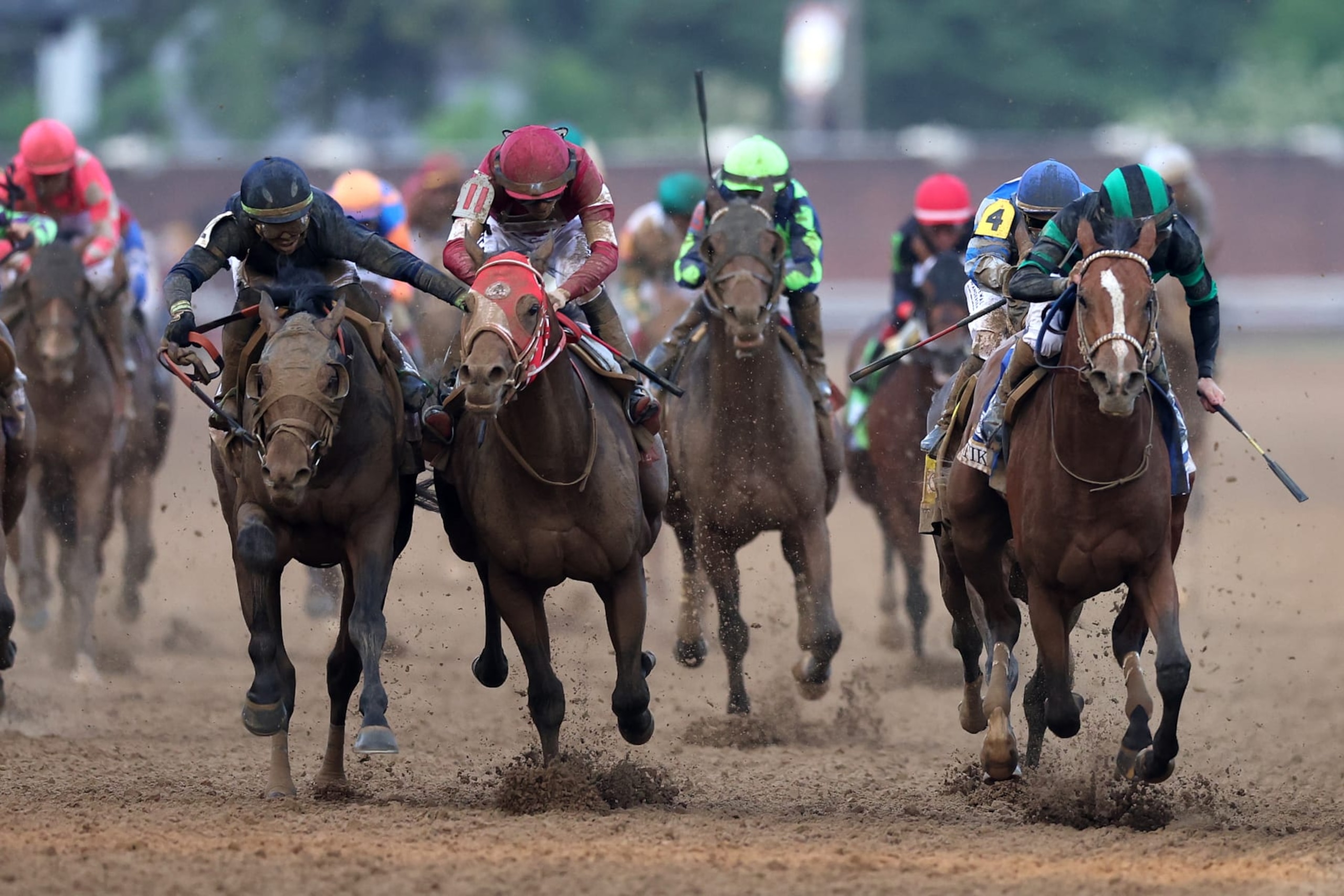 LOUISVILLE, KENTUCKY - MAY 04: Mystik Dan #3, ridden by jockey Brian J. Hernandez Jr. crosses the finish line ahead of Sierra Leone #2, ridden by jockey Tyler Gaffalione and Forever Young, ridden by jockey Ryusei Sakai to win the 150th running of the Kentucky Derby at Churchill Downs on May 04, 2024 in Louisville, Kentucky. (Photo by Rob Carr/Getty Images)
