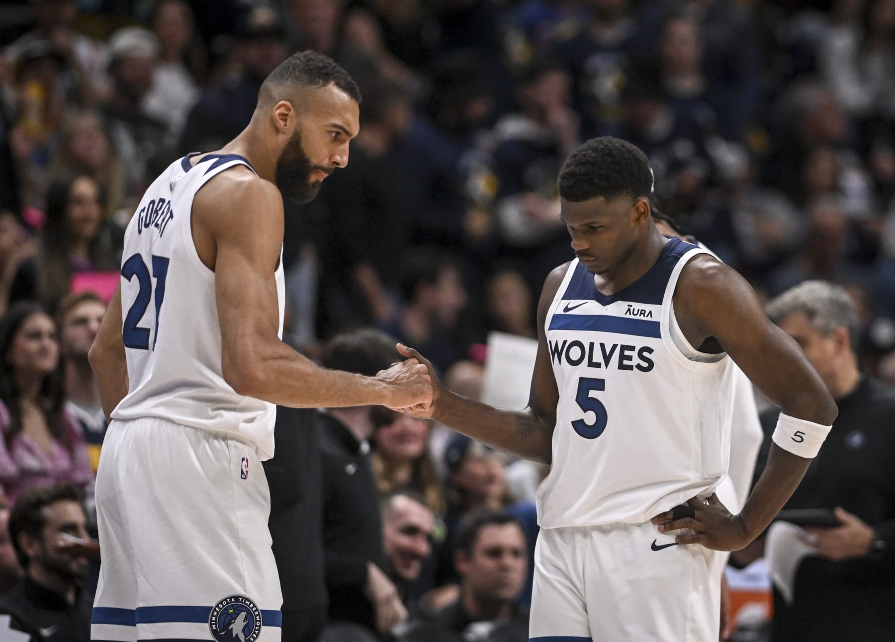 DENVER, CO - MAY 4: Rudy Gobert (27) shakes hands with Anthony Edwards (5) of the Minnesota Timberwolves during the fourth quarter of the Timberwolves' 106-99 win over the Denver Nuggets at Ball Arena in Denver on Saturday, May 4, 2024. (Photo by AAron Ontiveroz/The Denver Post)