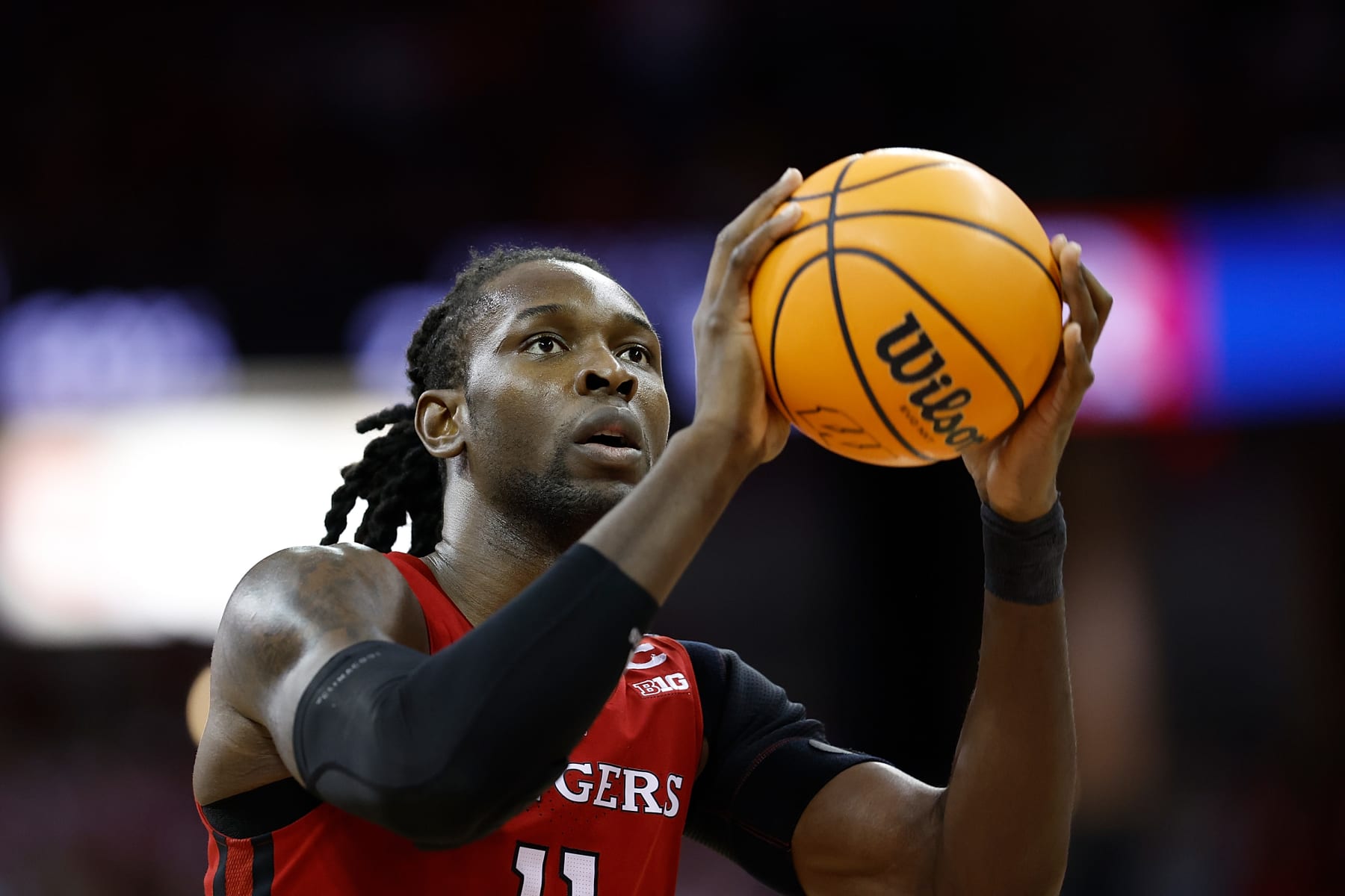 MADISON, WISCONSIN - MARCH 07: Clifford Omoruyi #11 of the Rutgers Scarlet Knights shoots a free throw in the first half of the game against the Wisconsin Badgers at Kohl Center on March 07, 2024 in Madison, Wisconsin. (Photo by John Fisher/Getty Images)