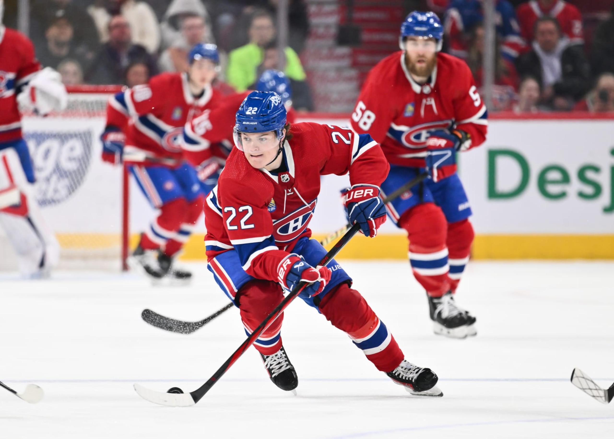 MONTREAL, CANADA - APRIL 16:  Cole Caufield #22 of the Montreal Canadiens skates the puck during the second period against the Detroit Red Wings at the Bell Centre on April 16, 2024 in Montreal, Quebec, Canada.  The Detroit Red Wings defeated the Montreal Canadiens 5-4 in a shootout.  (Photo by Minas Panagiotakis/Getty Images)