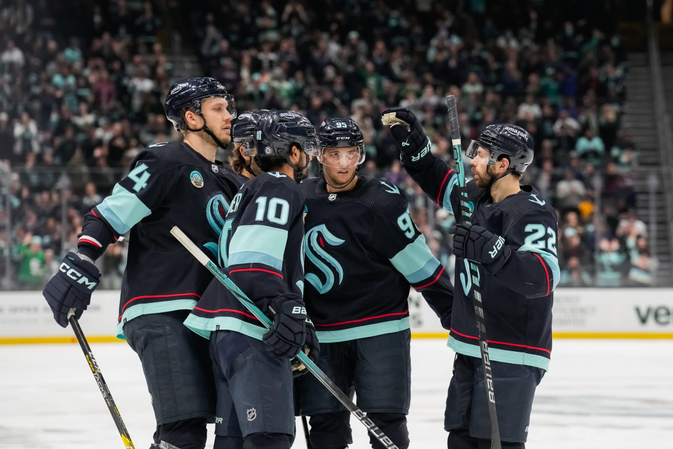 SEATTLE, WASHINGTON - APRIL 09: The Seattle Kraken celebrate a goal against the Arizona Coyotes during the third period of a game at Climate Pledge Arena on April 09, 2024 in Seattle, Washington. (Photo by Christopher Mast/NHLI via Getty Images)
