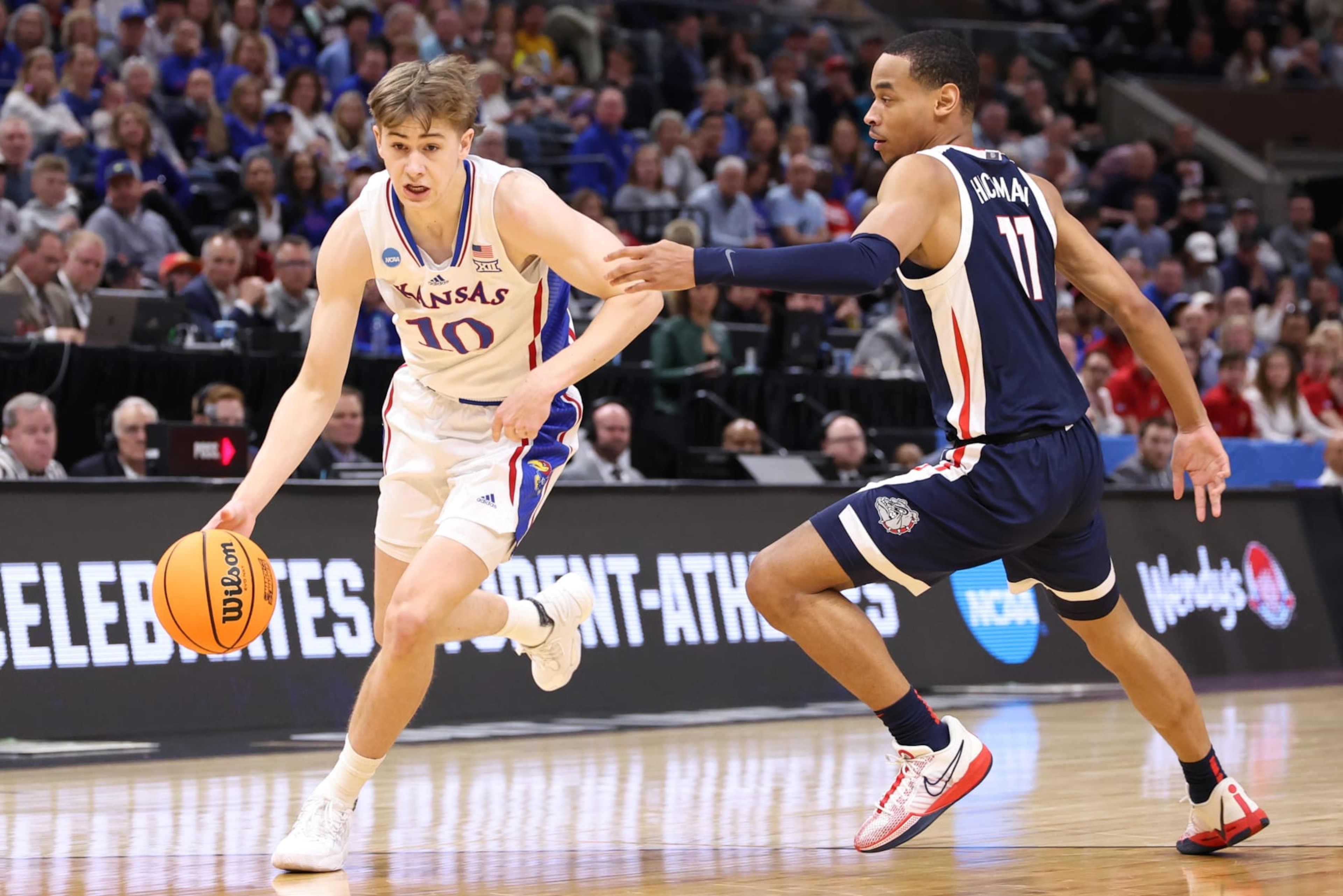 SALT LAKE CITY, UTAH - MARCH 23: Johnny Furphy #10 of the Kansas Jayhawks dribbles against Nolan Hickman #11 of the Gonzaga Bulldogs during the first half in the second round of the NCAA Men's Basketball Tournament at Delta Center on March 23, 2024 in Salt Lake City, Utah. (Photo by Christian Petersen/Getty Images) SALT LAKE CITY, UTAH - MARCH 23: Johnny Furphy #10 of the Kansas Jayhawks dribbles against Nolan Hickman #11 of the Gonzaga Bulldogs during the first half in the second round of the NCAA Men's Basketball Tournament at Delta Center on March 23, 2024 in Salt Lake City, Utah. (Photo by Christian Petersen/Getty Images)