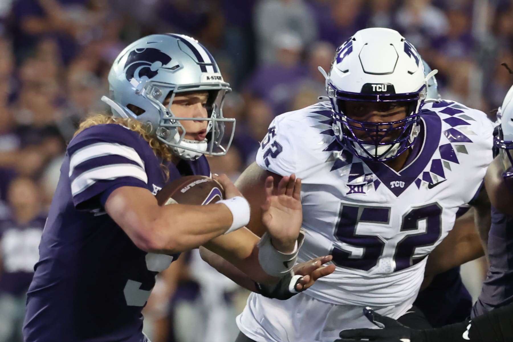 MANHATTAN, KS - OCTOBER 21: TCU Horned Frogs defensive lineman Damonic Williams (52) pursues Kansas State Wildcats quarterback Avery Johnson (5) in the first quarter of a Big 12 college football game between the TCU Horned Frogs and Kansas State Wildcats on Oct 21, 2023 at Bill Snyder Family Stadium in Manhattan, KS.  (Photo by Scott Winters/Icon Sportswire via Getty Images)
