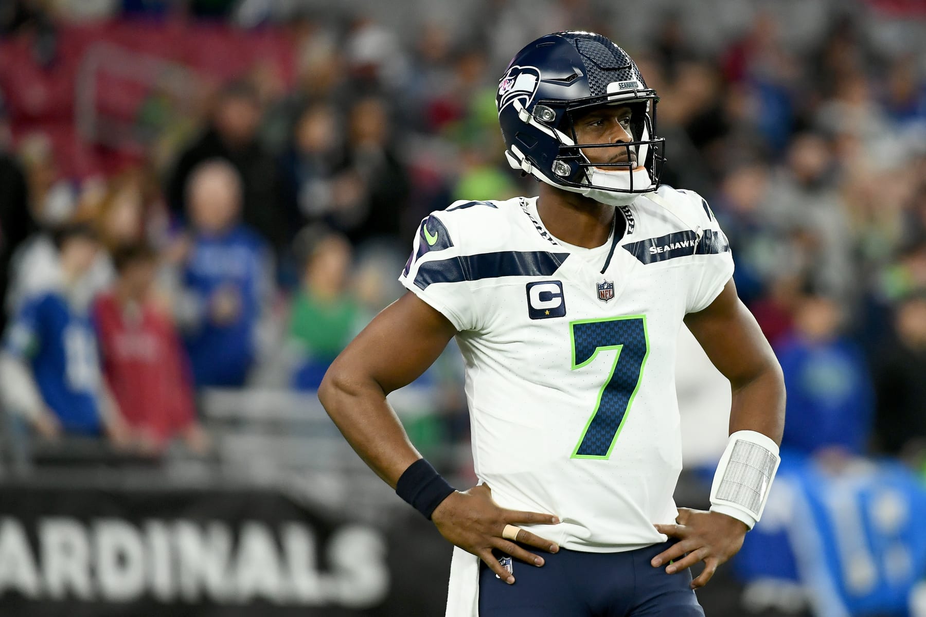 GLENDALE, ARIZONA - JANUARY 07: Geno Smith #7 of the Seattle Seahawks looks on before the game against the Arizona Cardinals at State Farm Stadium on January 07, 2024 in Glendale, Arizona. (Photo by Jennifer Stewart/Getty Images)