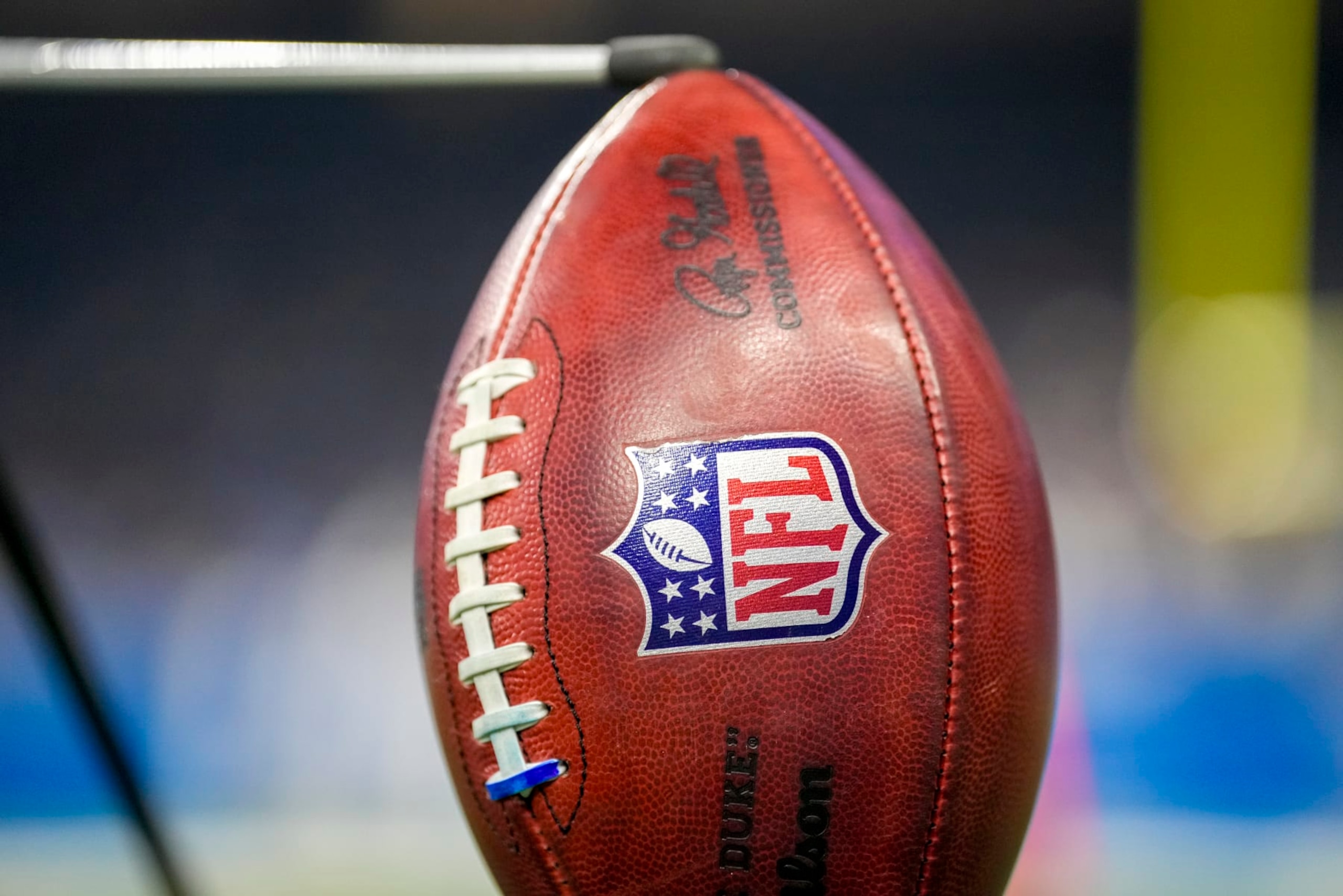 DETROIT, MICHIGAN - JANUARY 07: A detail of a Wilson brand NFL The Duke football held up by a kicking tee during the game between the Minnesota Vikings and Detroit Lions Ford Field on January 07, 2024 in Detroit, Michigan. (Photo by Nic Antaya/Getty Images) DETROIT, MICHIGAN - JANUARY 07: A detail of a Wilson brand NFL The Duke football held up by a kicking tee during the game between the Minnesota Vikings and Detroit Lions Ford Field on January 07, 2024 in Detroit, Michigan. (Photo by Nic Antaya/Getty Images)