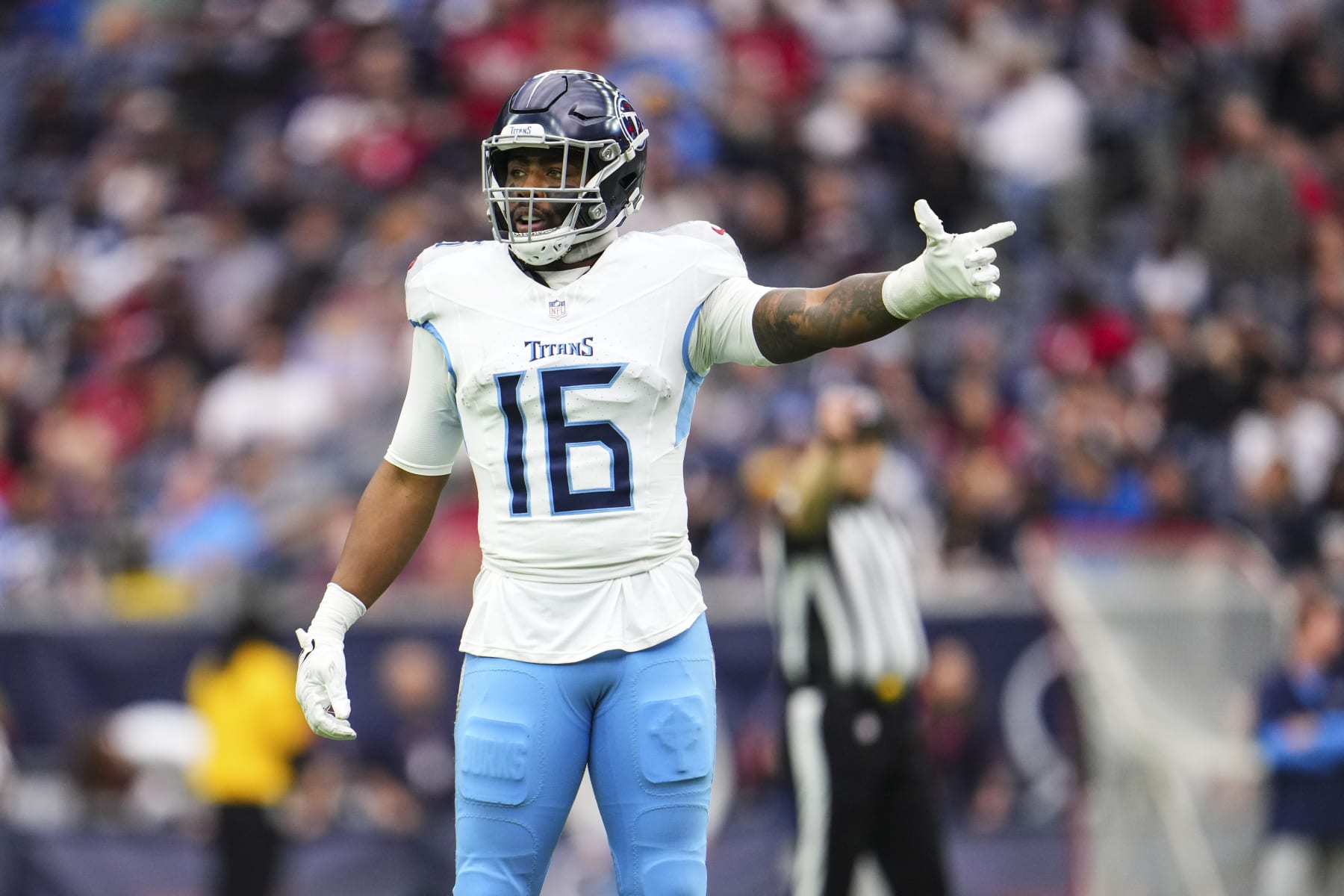 HOUSTON, TX - DECEMBER 31: Treylon Burks #16 of the Tennessee Titans looks on from the field an NFL football game against the Houston Texans at NRG Stadium on December 31, 2023 in Houston, Texas. (Photo by Cooper Neill/Getty Images)