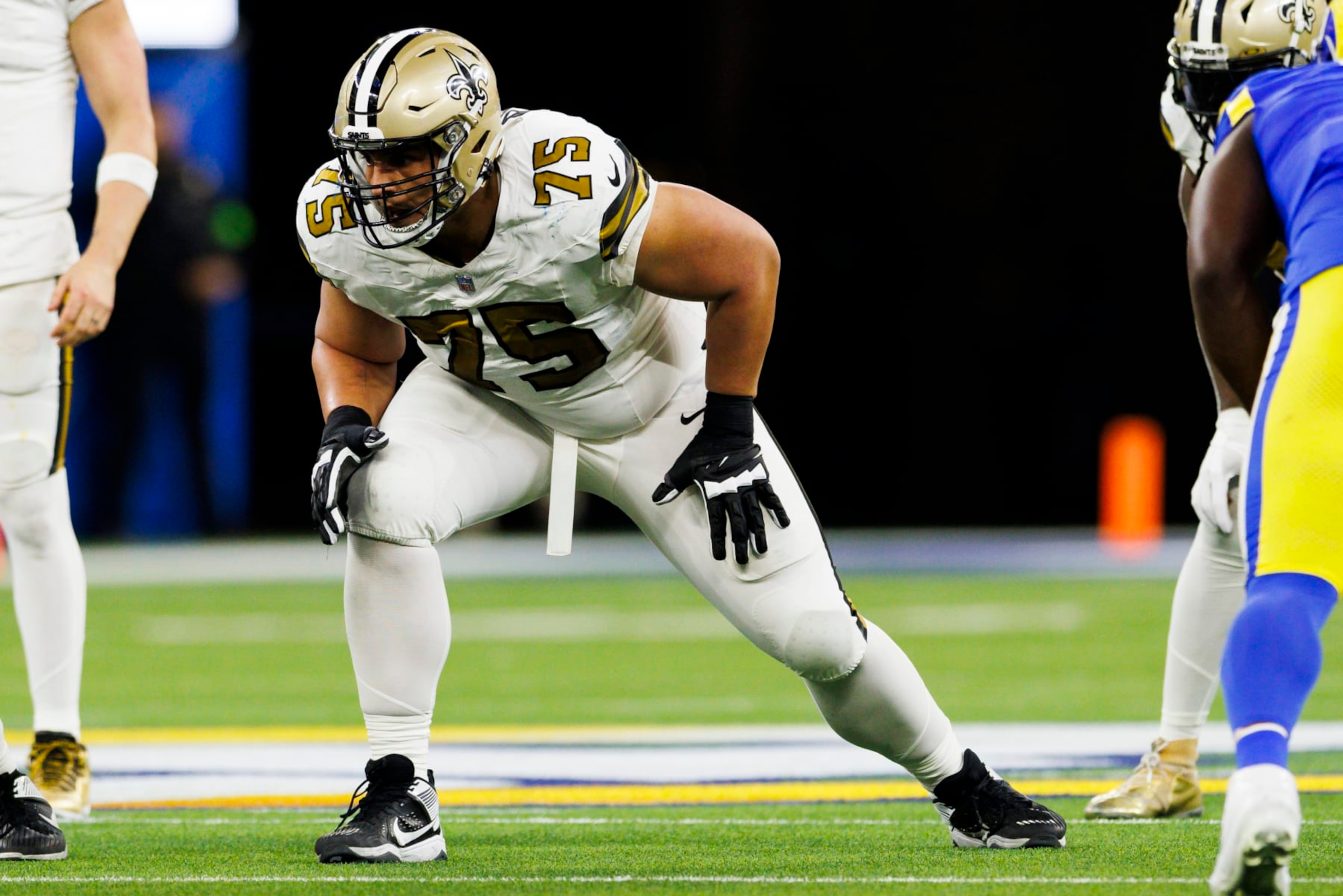 INGLEWOOD, CALIFORNIA - DECEMBER 21: Andrus Peat #75 of the New Orleans Saints in an offensive stance during a game against the Los Angeles Rams at SoFi Stadium on December 21, 2023 in Inglewood, California. (Photo by Ric Tapia/Getty Images) INGLEWOOD, CALIFORNIA - DECEMBER 21: Andrus Peat #75 of the New Orleans Saints in an offensive stance during a game against the Los Angeles Rams at SoFi Stadium on December 21, 2023 in Inglewood, California. (Photo by Ric Tapia/Getty Images)