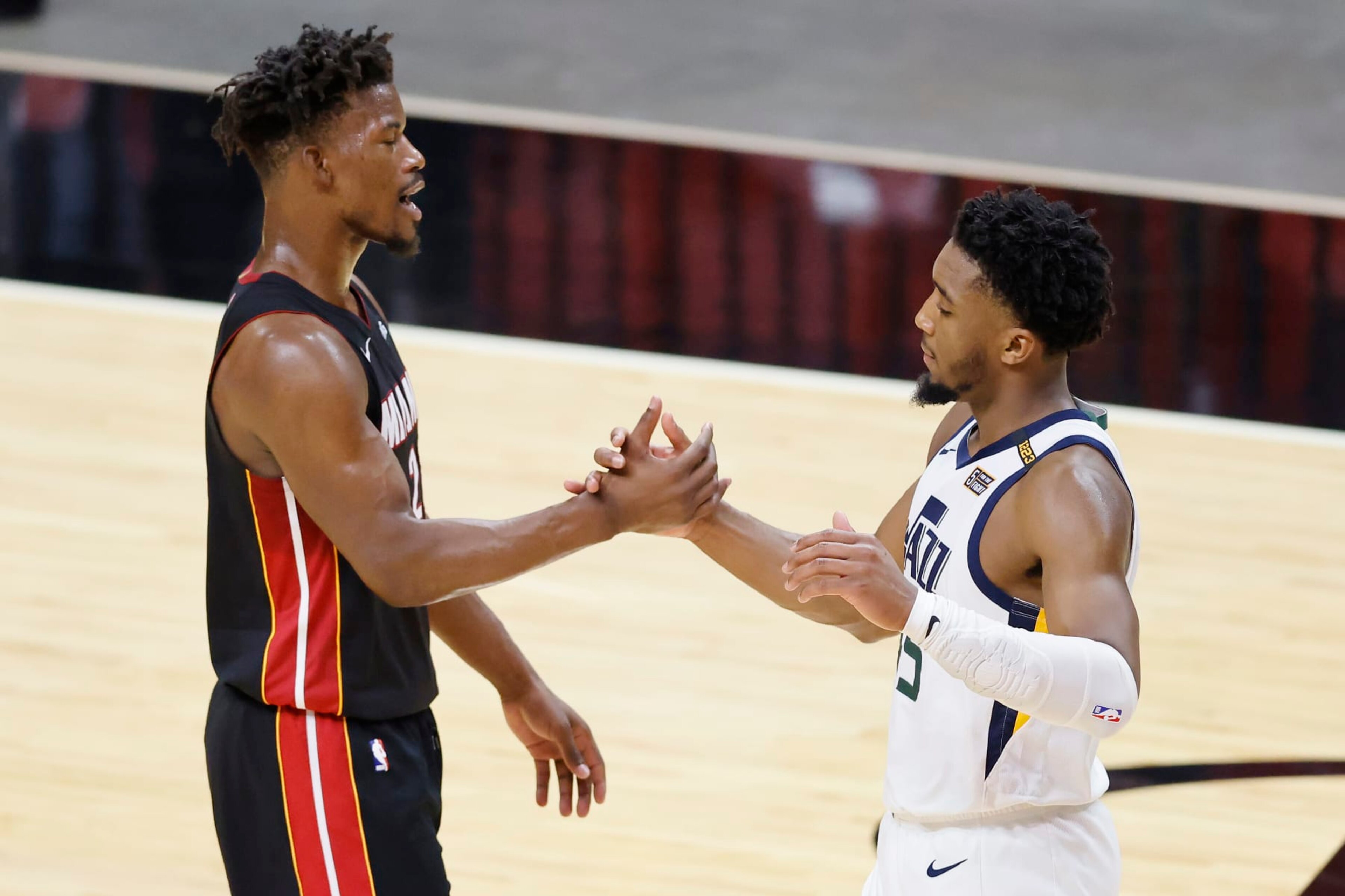 MIAMI, FLORIDA - FEBRUARY 26: Jimmy Butler #22 of the Miami Heat greets Donovan Mitchell #45 of the Utah Jazz after the game at American Airlines Arena on February 26, 2021 in Miami, Florida. NOTE TO USER: User expressly acknowledges and agrees that, by downloading and or using this photograph, User is consenting to the terms and conditions of the Getty Images License Agreement. (Photo by Michael Reaves/Getty Images) MIAMI, FLORIDA - FEBRUARY 26: Jimmy Butler #22 of the Miami Heat greets Donovan Mitchell #45 of the Utah Jazz after the game at American Airlines Arena on February 26, 2021 in Miami, Florida. NOTE TO USER: User expressly acknowledges and agrees that, by downloading and or using this photograph, User is consenting to the terms and conditions of the Getty Images License Agreement. (Photo by Michael Reaves/Getty Images)