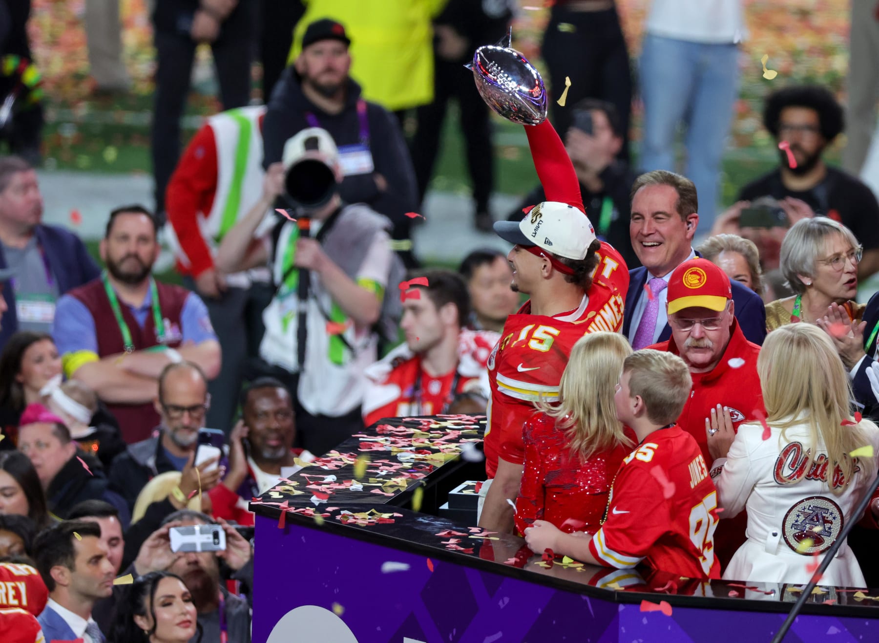 LAS VEGAS, NEVADA - FEBRUARY 11: Quarterback Patrick Mahomes #15 of the Kansas City Chiefs holds up the Vince Lombardi Trophy as head coach Andy Reid looks on as the Chiefs celebrates their 25-22 overtime victory over the San Francisco 49ers in Super Bowl LVIII at Allegiant Stadium on February 11, 2024 in Las Vegas, Nevada. (Photo by Ethan Miller/Getty Images)