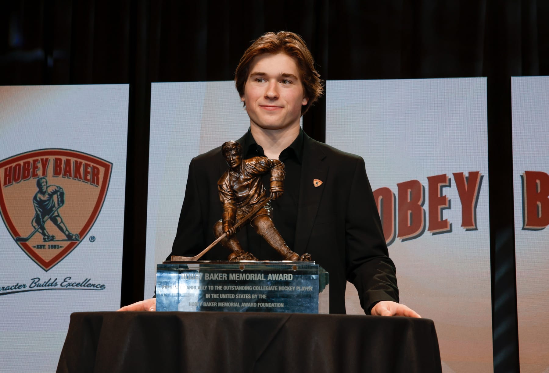 ST. PAUL, MINNESOTA - APRIL 12: Macklin Celebrini #71 of the Boston University Terriers wins the 2024 Hobey Baker Memorial Award during the 2024 Hobey Baker Memorial & Mike Richter Award Ceremonies at the RiverCenter on April 12, 2024 in St. Paul, Minnesota. (Photo by Richard T Gagnon/Getty Images)