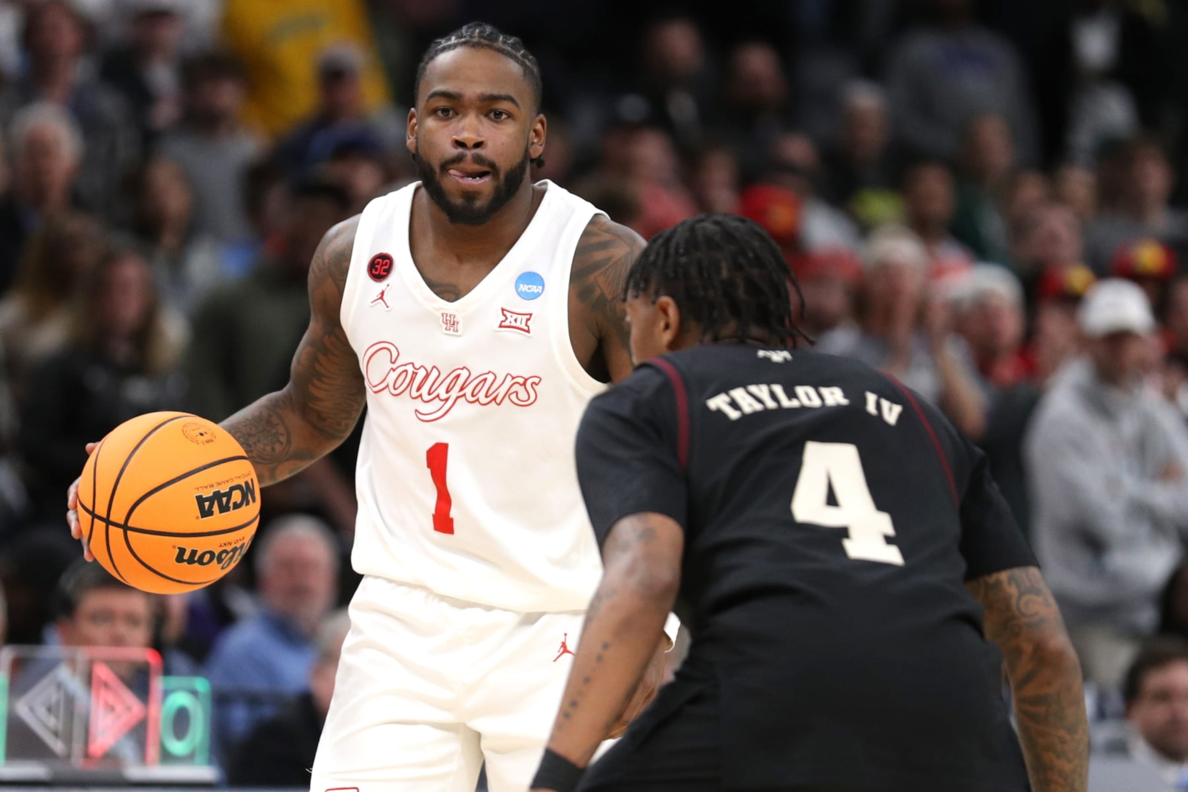 MEMPHIS, TENNESSEE - MARCH 24: Jamal Shead #1 of the Houston Cougars dribbles the ball over Wade Taylor IV #4 of the Texas A&M Aggies during overtime in the second round of the NCAA Men's Basketball Tournament at FedExForum on March 24, 2024 in Memphis, Tennessee. (Photo by Justin Ford/Getty Images) MEMPHIS, TENNESSEE - MARCH 24: Jamal Shead #1 of the Houston Cougars dribbles the ball over Wade Taylor IV #4 of the Texas A&M Aggies during overtime in the second round of the NCAA Men's Basketball Tournament at FedExForum on March 24, 2024 in Memphis, Tennessee. (Photo by Justin Ford/Getty Images)