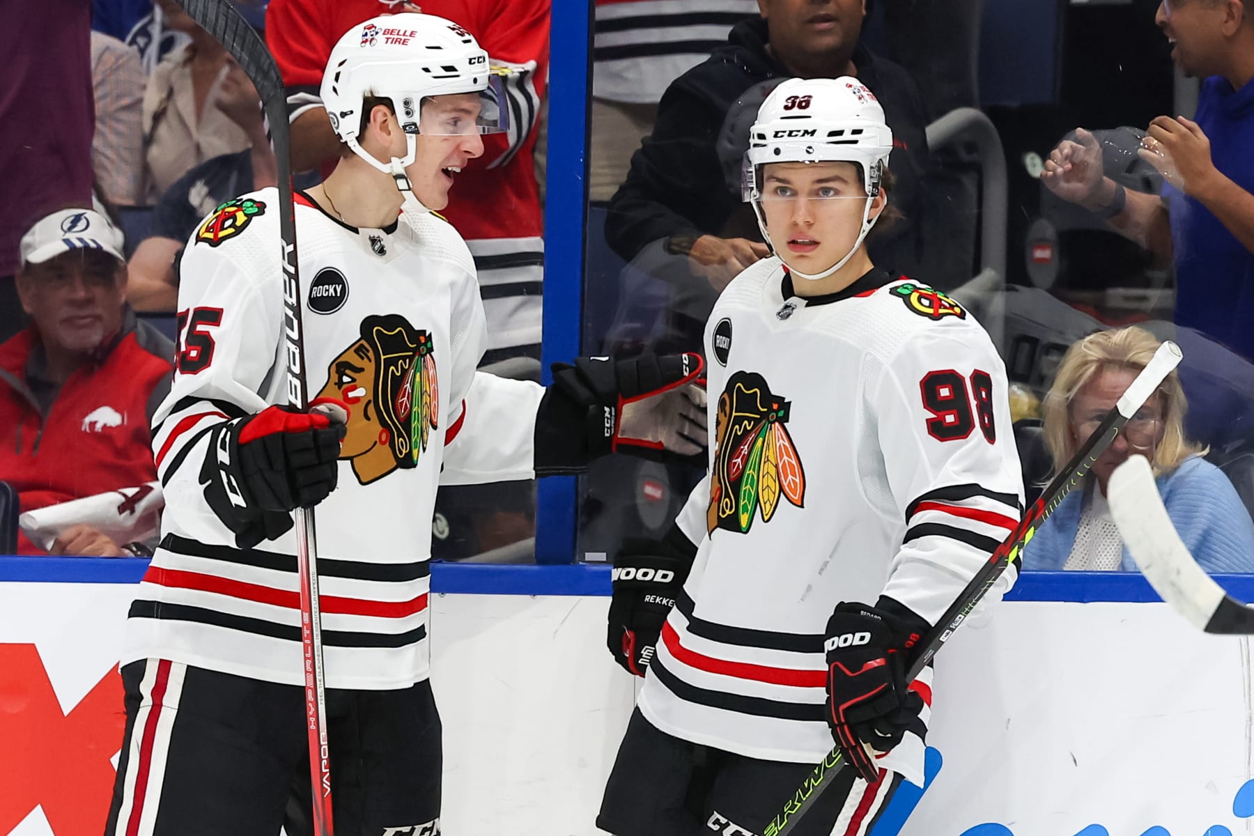 TAMPA, FL - NOVEMBER 09: Kevin Korchinski #55 of the Chicago Blackhawks, left, congratulates Connor Bedard #98 on his second goal against the Tampa Bay Lightning during the first period at the Amalie Arena on November 9, 2023 in Tampa, Florida. (Photo by Mike Carlson/Getty Images)