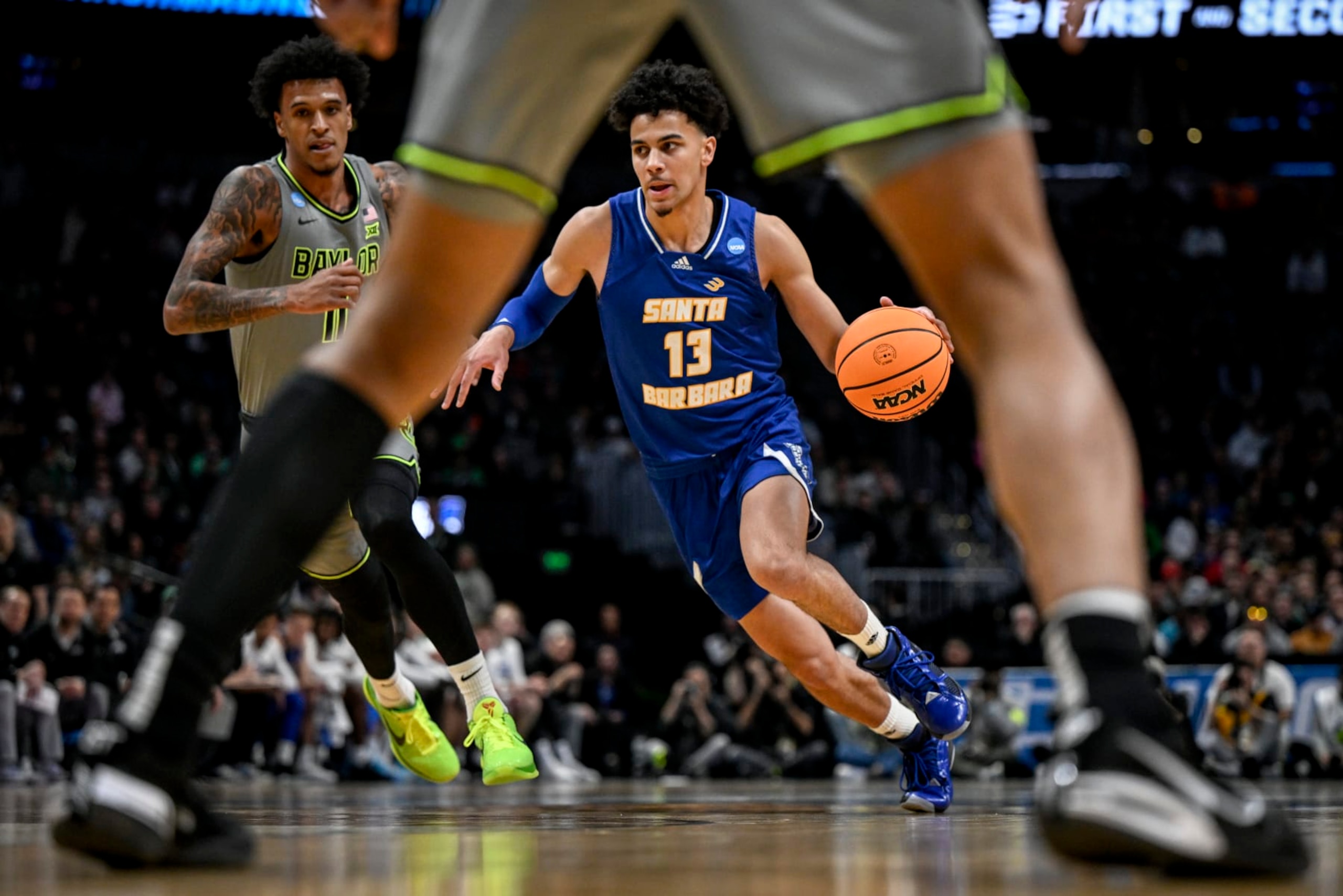 DENVER, CO - MARCH 17: Ajay Mitchell (13) of the UC Santa Barbara Gauchos drives on Jalen Bridges (11) of the Baylor Bears during the first half of their first round NCAA mens basketball tournament game at Ball Arena in Denver on Friday, March 17, 2023. (Photo by AAron Ontiveroz/MediaNews Group/The Denver Post via Getty Images)