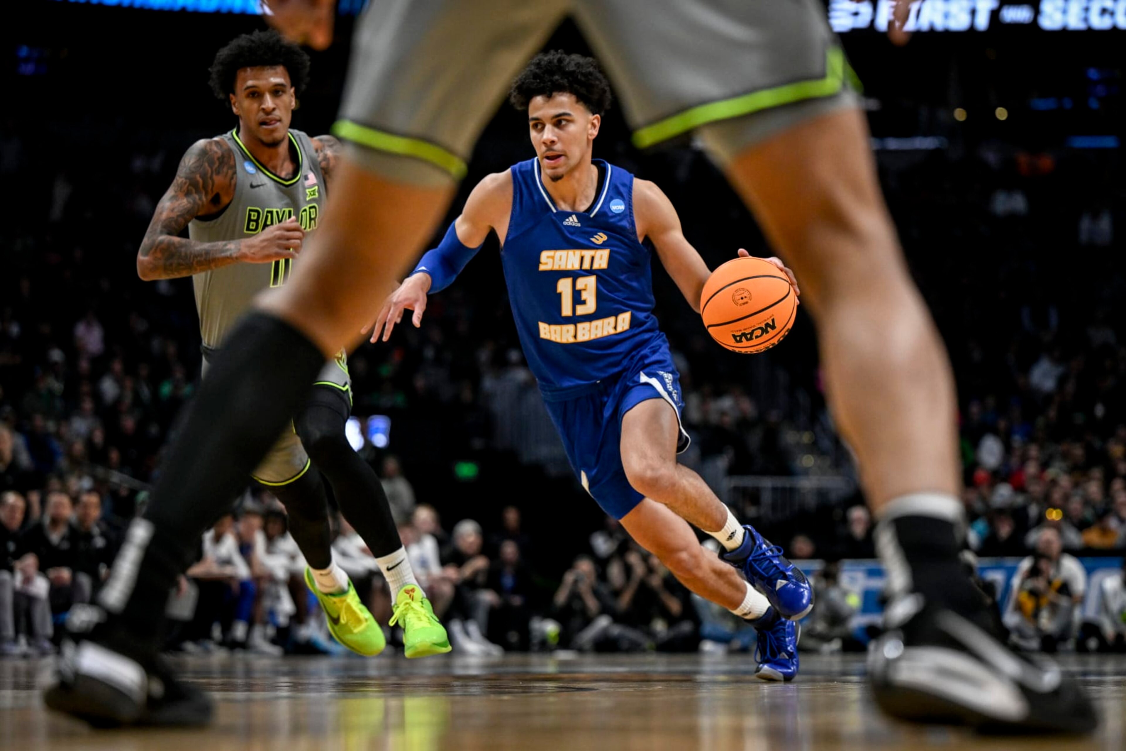 DENVER, CO - MARCH 17: Ajay Mitchell (13) of the UC Santa Barbara Gauchos drives on Jalen Bridges (11) of the Baylor Bears during the first half of their first round NCAA mens basketball tournament game at Ball Arena in Denver on Friday, March 17, 2023. (Photo by AAron Ontiveroz/MediaNews Group/The Denver Post via Getty Images) DENVER, CO - MARCH 17: Ajay Mitchell (13) of the UC Santa Barbara Gauchos drives on Jalen Bridges (11) of the Baylor Bears during the first half of their first round NCAA mens basketball tournament game at Ball Arena in Denver on Friday, March 17, 2023. (Photo by AAron Ontiveroz/MediaNews Group/The Denver Post via Getty Images)