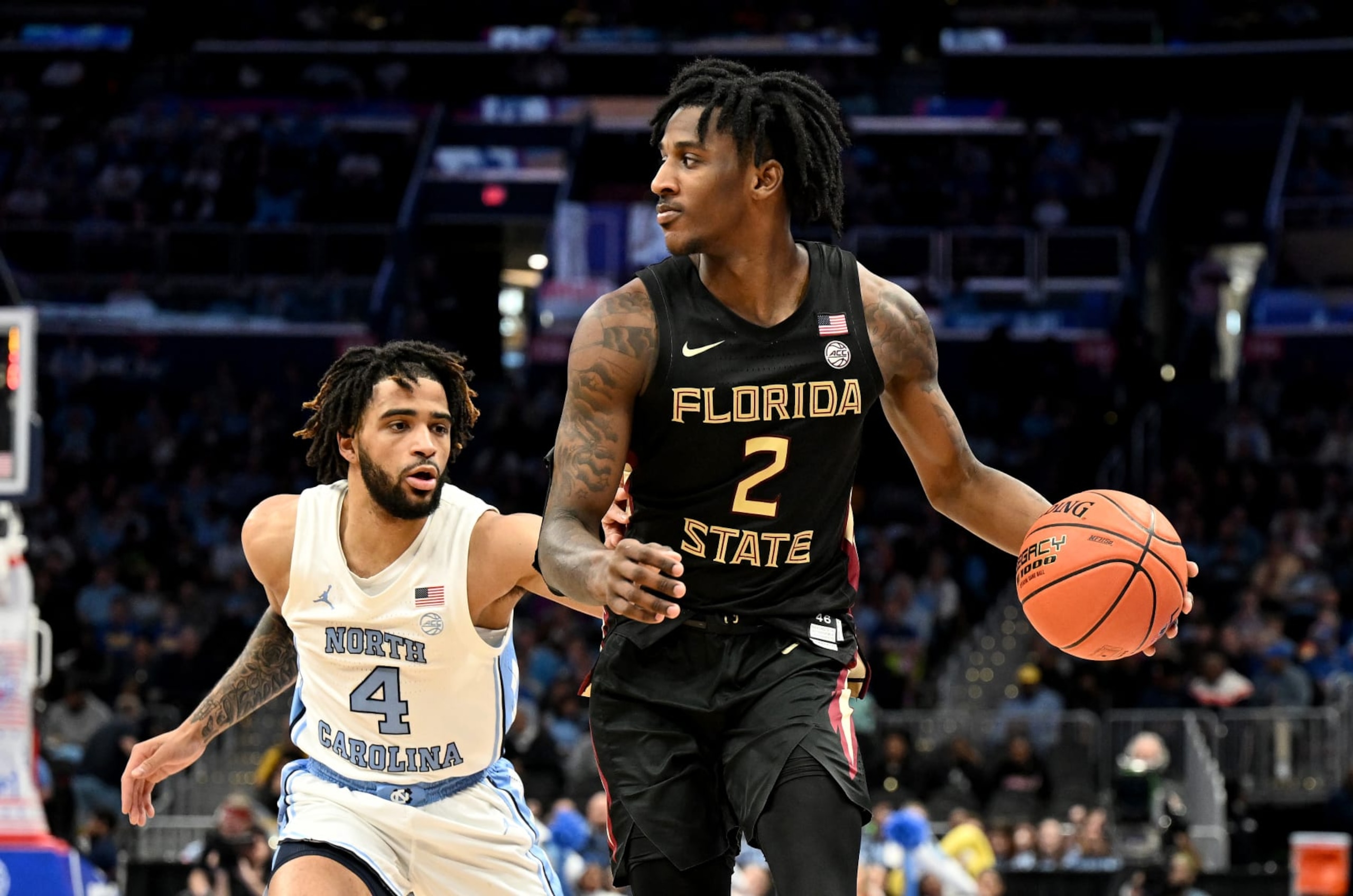 WASHINGTON, DC - MARCH 14: Jamir Watkins #2 of the Florida State Seminoles handles the ball against RJ Davis #4 of the North Carolina Tar Heels in the Quarterfinals of the ACC Men's Basketball Tournament  at Capital One Arena on March 14, 2024 in Washington, DC. (Photo by G Fiume/Getty Images)