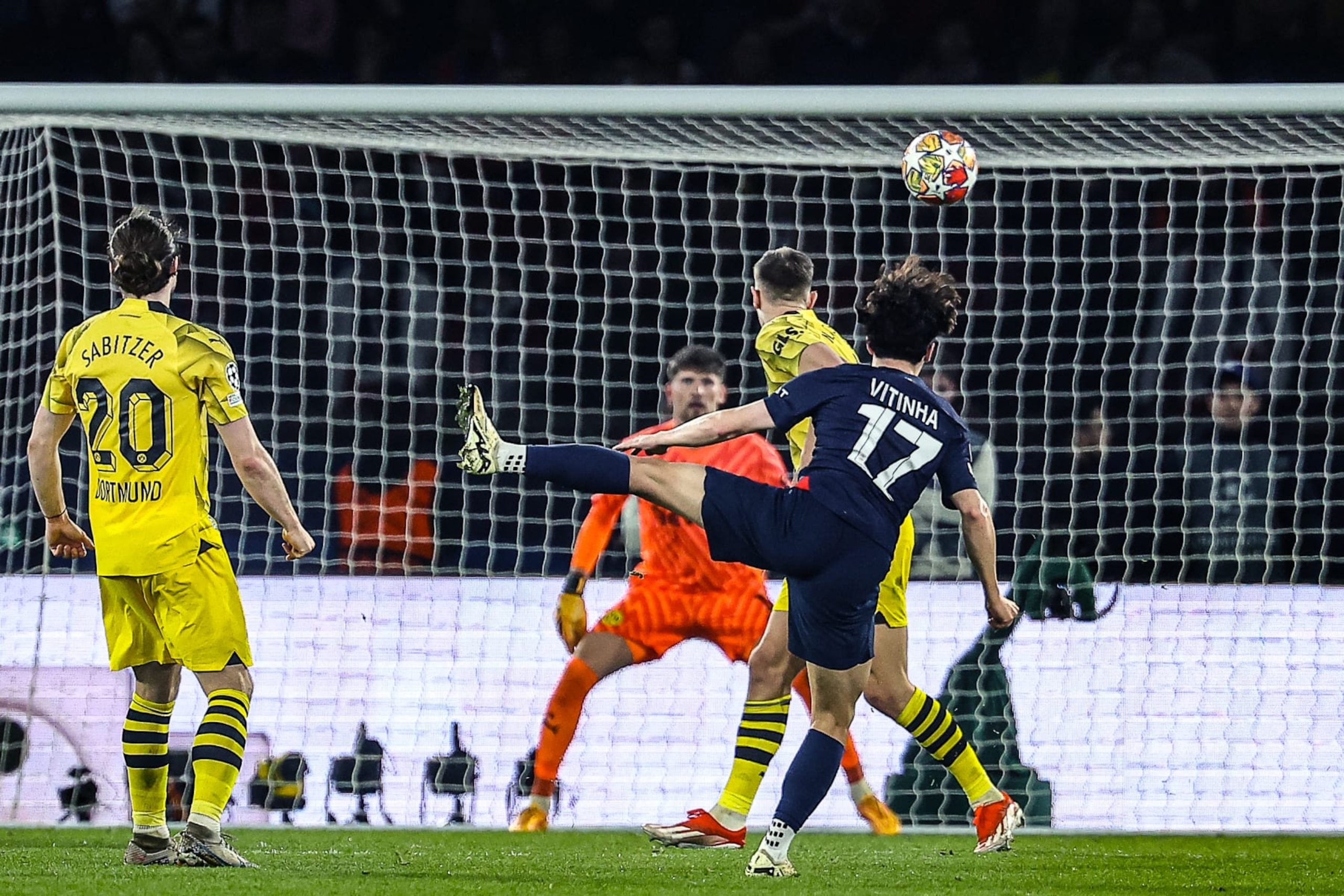 Paris Saint-Germain's Portuguese midfielder #17 Vitinha (R) watches as a shot hits the crossbar during the UEFA Champions League semi-final second leg football match between Paris Saint-Germain (PSG) and Borussia Dortmund, at the Parc des Princes stadium in Paris on May 7, 2024. (Photo by FRANCK FIFE / AFP) (Photo by FRANCK FIFE/AFP via Getty Images)