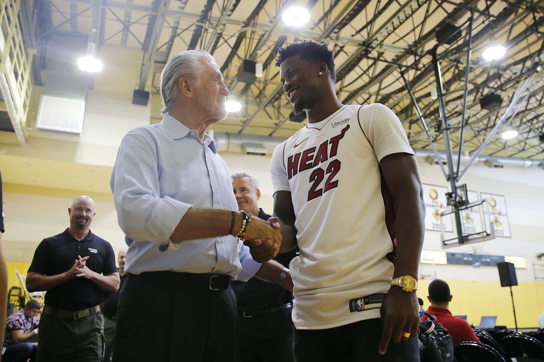 MIAMI, FLORIDA - SEPTEMBER 27:  Jimmy Butler #22 of the Miami Heat shakes hands with president Pat Riley after his introductory press conference at American Airlines Arena on September 27, 2019 in Miami, Florida. NOTE TO USER: User expressly acknowledges and agrees that, by downloading and or using this photograph, User is consenting to the terms and conditions of the Getty Images License Agreement.  (Photo by Michael Reaves/Getty Images)