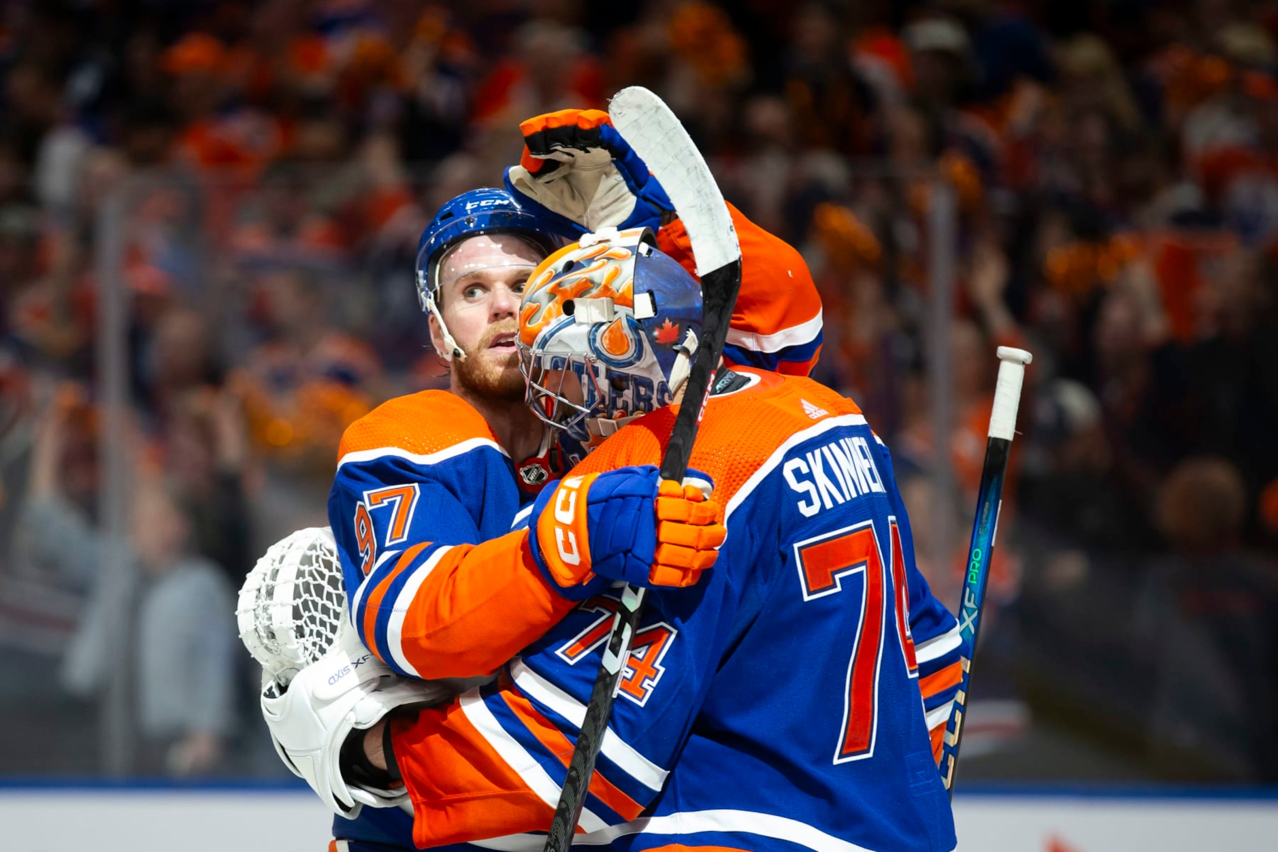 EDMONTON, CANADA - MAY 1: Connor McDavid #97 and goaltender Stuart Skinner #74 of the Edmonton Oilers celebrate a 4-3 victory against of the Los Angeles Kings during the third period in Game Five of the First Round of the 2024 Stanley Cup Playoffs at Rogers Place on May 1, 2024, in Edmonton, Canada.  (Photo by Codie McLachlan/Getty Images)