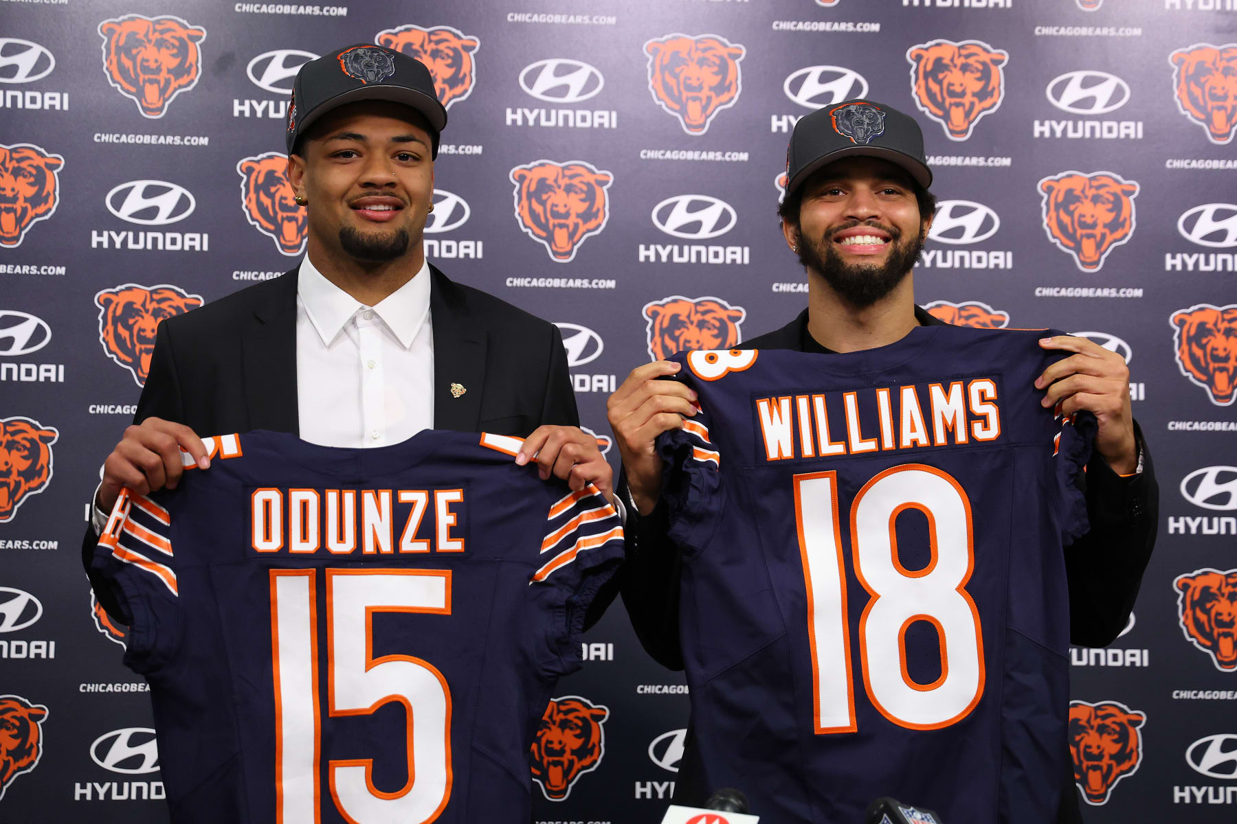 LAKE FOREST, ILLINOIS - APRIL 26: Rome Odunze #15 and Caleb Williams #18 of the Chicago Bears pose for a photo during their introductory press conference at Halas Hall on April 26, 2024 in Lake Forest, Illinois. Caleb Williams was selected first overall and Rome Odunze was selected ninth overall in the first round of the 2024 NFL Draft Thursday. (Photo by Michael Reaves/Getty Images)