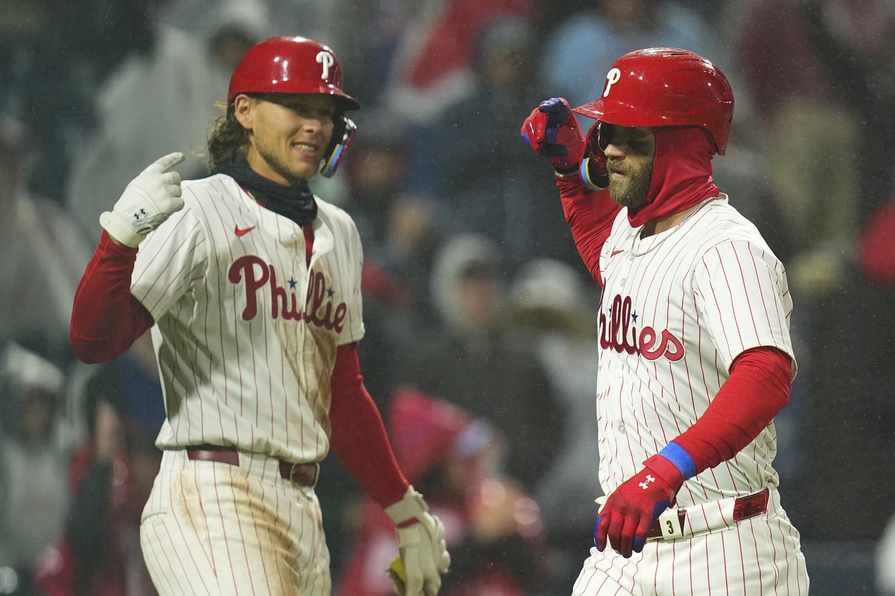 Alec Bohm, left, and Bryce Harper.