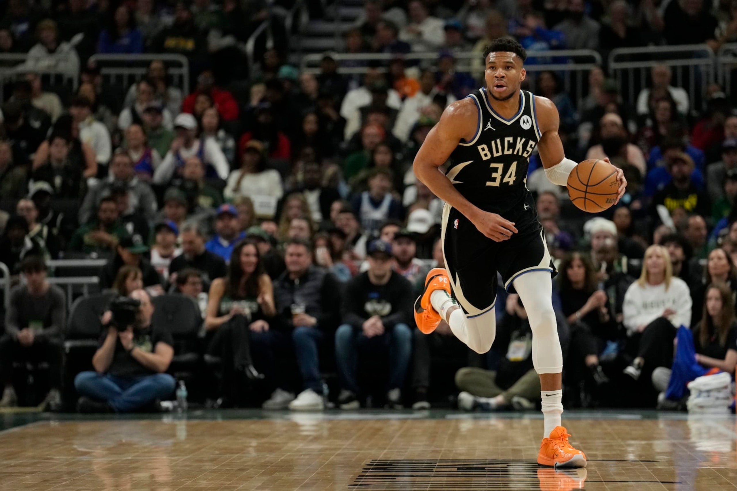 MILWAUKEE, WISCONSIN - APRIL 07: Giannis Antetokounmpo #34 of the Milwaukee Bucks dribbles the ball during the first half against the New York Knicks at Fiserv Forum on April 07, 2024 in Milwaukee, Wisconsin. NOTE TO USER: User expressly acknowledges and agrees that, by downloading and or using this photograph, User is consenting to the terms and conditions of the Getty Images License Agreement. (Photo by Patrick McDermott/Getty Images)
