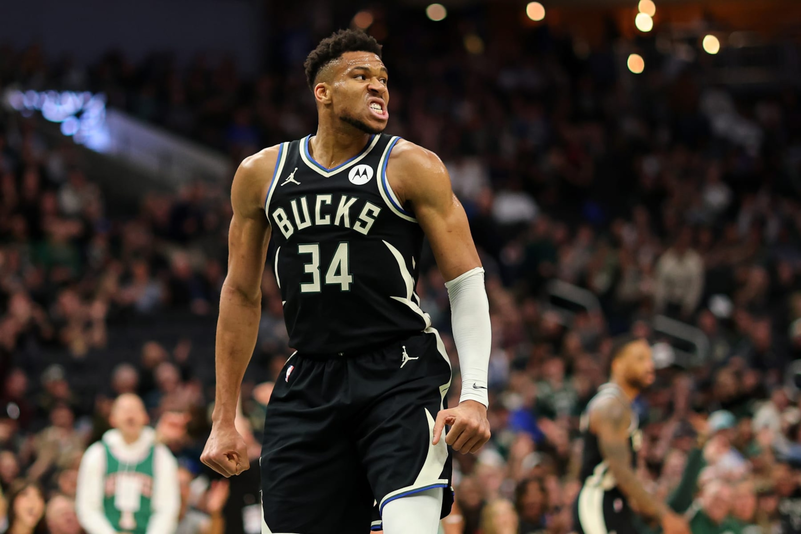 MILWAUKEE, WISCONSIN - APRIL 09: Giannis Antetokounmpo #34 of the Milwaukee Bucks reacts to a score during the first half of a game against the Boston Celtics at Fiserv Forum on April 09, 2024 in Milwaukee, Wisconsin. NOTE TO USER: User expressly acknowledges and agrees that, by downloading and or using this photograph, User is consenting to the terms and conditions of the Getty Images License Agreement. (Photo by Stacy Revere/Getty Images)