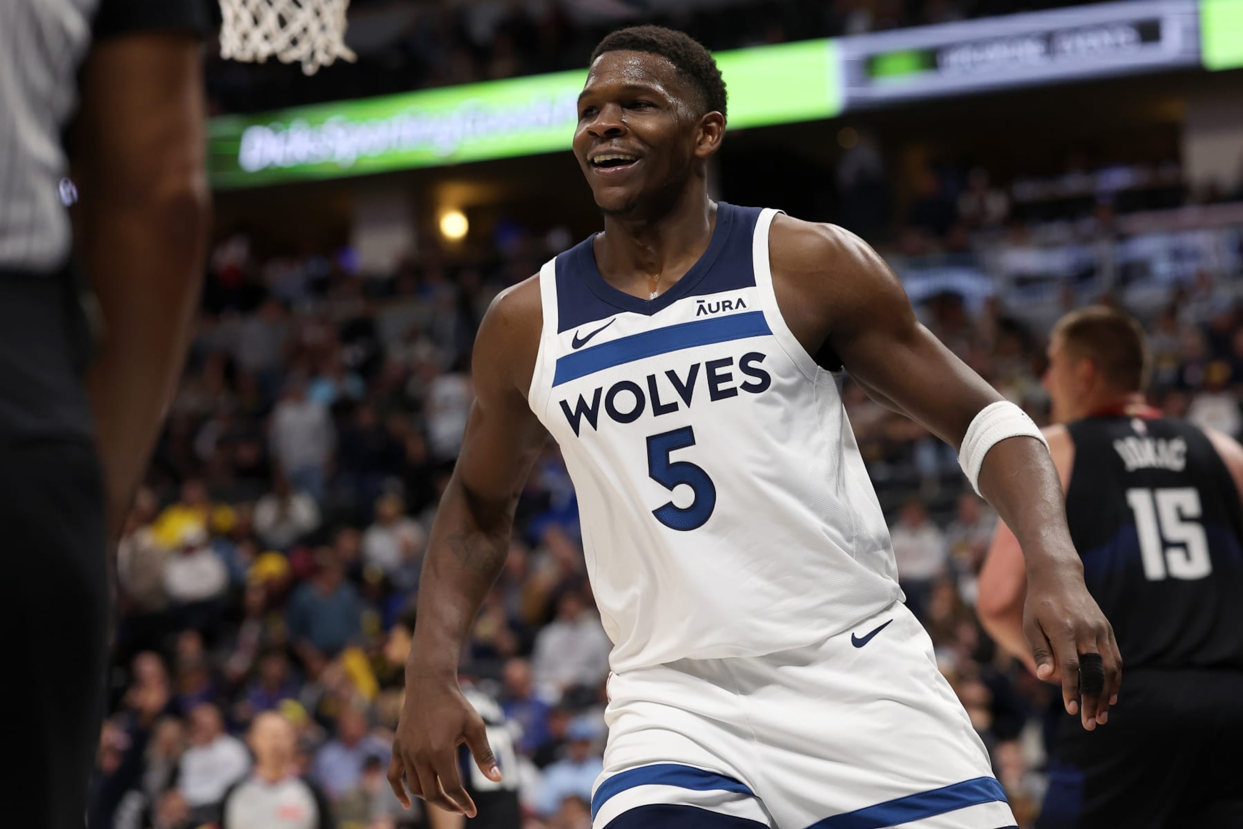 DENVER, COLORADO - MAY 06: Anthony Edwards #5 of the Minnesota Timberwolves celebrates against the Denver Nuggets in the fourth quarter during Game Two of the Western Conference Second Round Playoffs at Ball Arena on May 06, 2024 in Denver, Colorado. NOTE TO USER: User expressly acknowledges and agrees that, by downloading and or using this photograph, User is consenting to the terms and conditions of the Getty Images License Agreement. (Photo by Matthew Stockman/Getty Images)