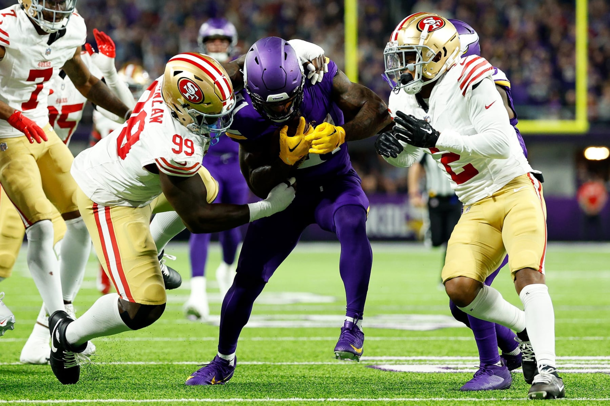 MINNEAPOLIS, MINNESOTA - OCTOBER 23: Cam Akers #31 of the Minnesota Vikings is tackled by Javon Kinlaw #99 of the San Francisco 49ers in the first half at U.S. Bank Stadium on October 23, 2023 in Minneapolis, Minnesota. The Vikings defeated the 49ers 22-17. (Photo by David Berding/Getty Images)