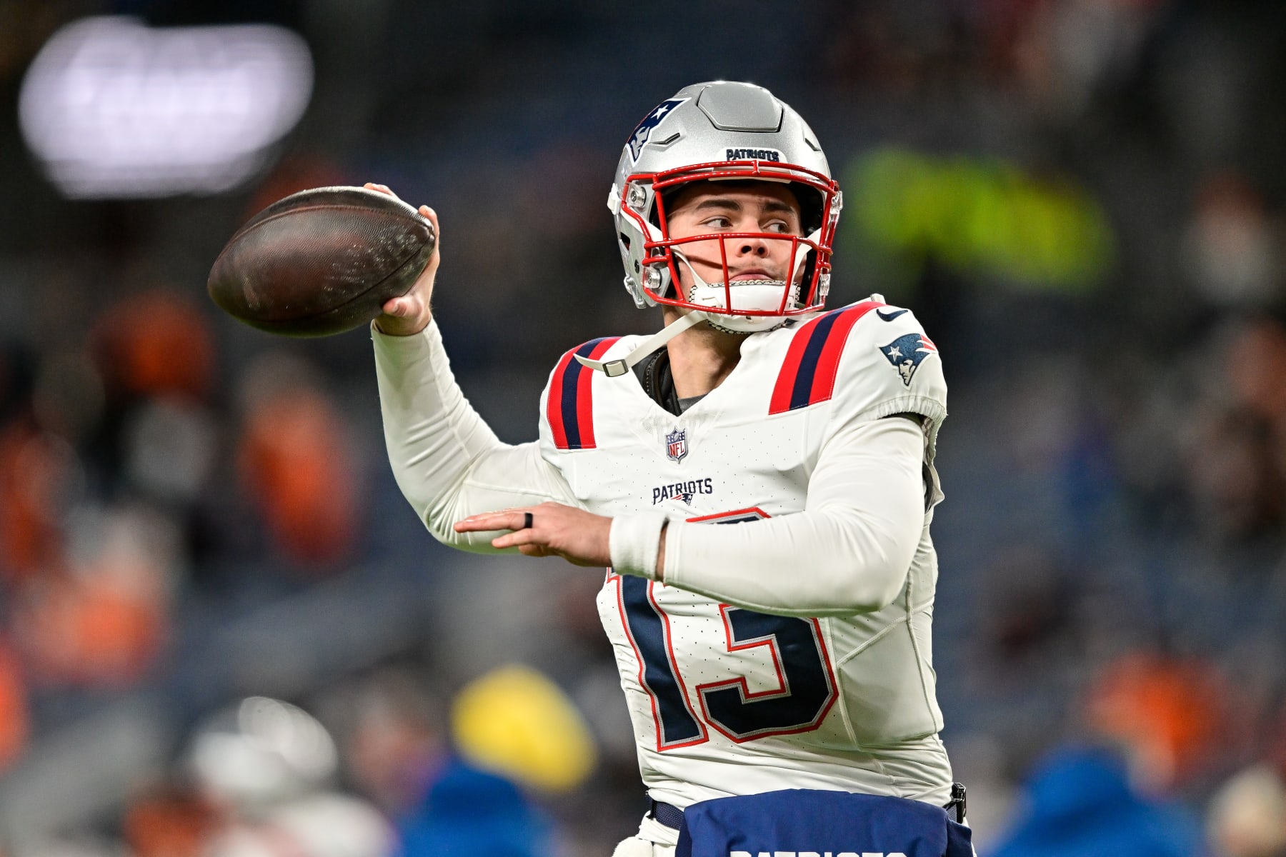 DENVER, COLORADO - DECEMBER 24:  Nathan Rourke #13 of the New England Patriots warms up before a game against the Denver Broncos at Empower Field at Mile High on December 24, 2023 in Denver, Colorado. (Photo by Dustin Bradford/Getty Images)