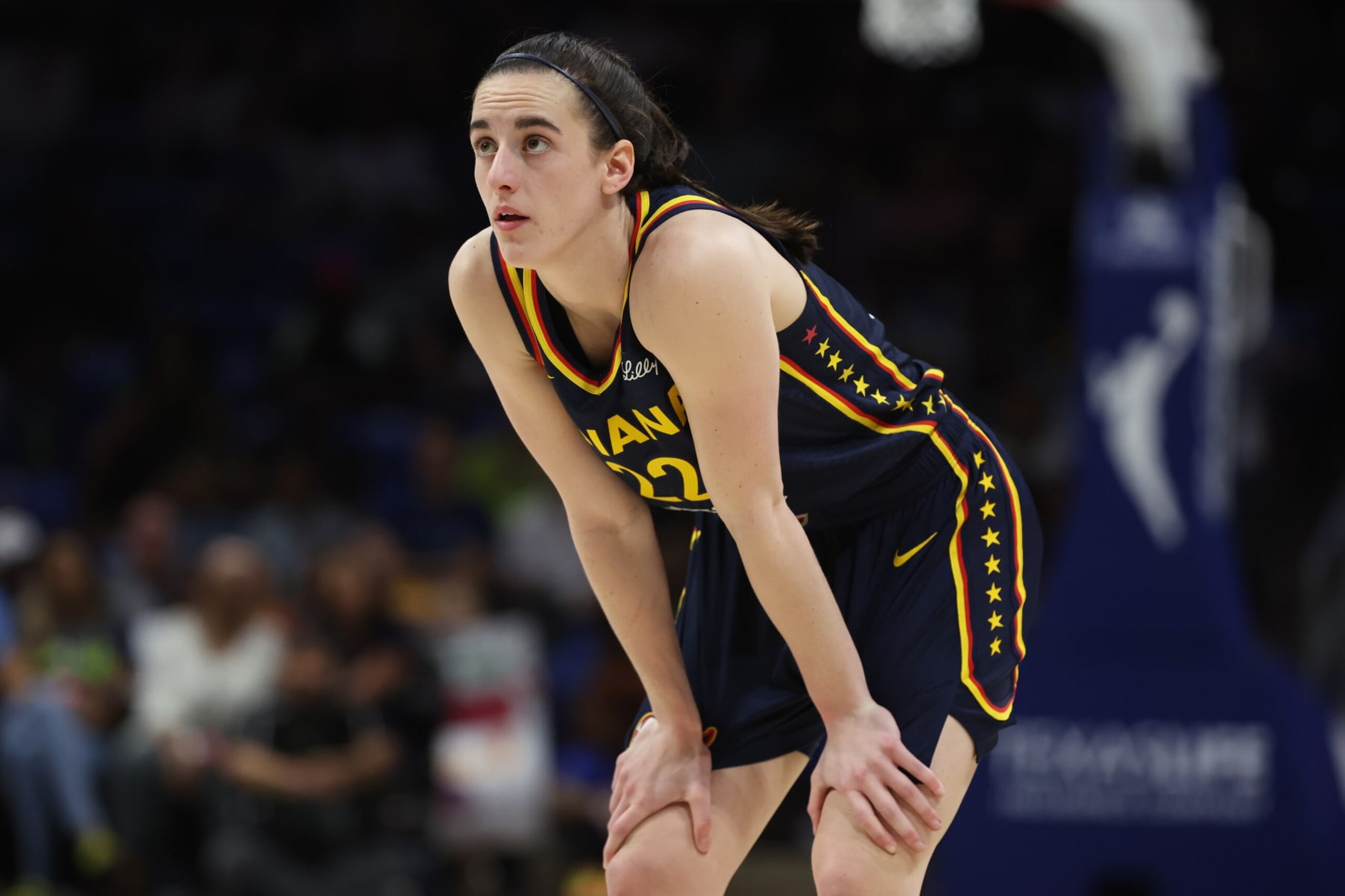 ARLINGTON, TEXAS - MAY 03: Caitlin Clark #22 of the Indiana Fever looks on while playing the Dallas Wings during a pre season game at College Park Center on May 03, 2024 in Arlington, Texas.  (Photo by Gregory Shamus/Getty Images)