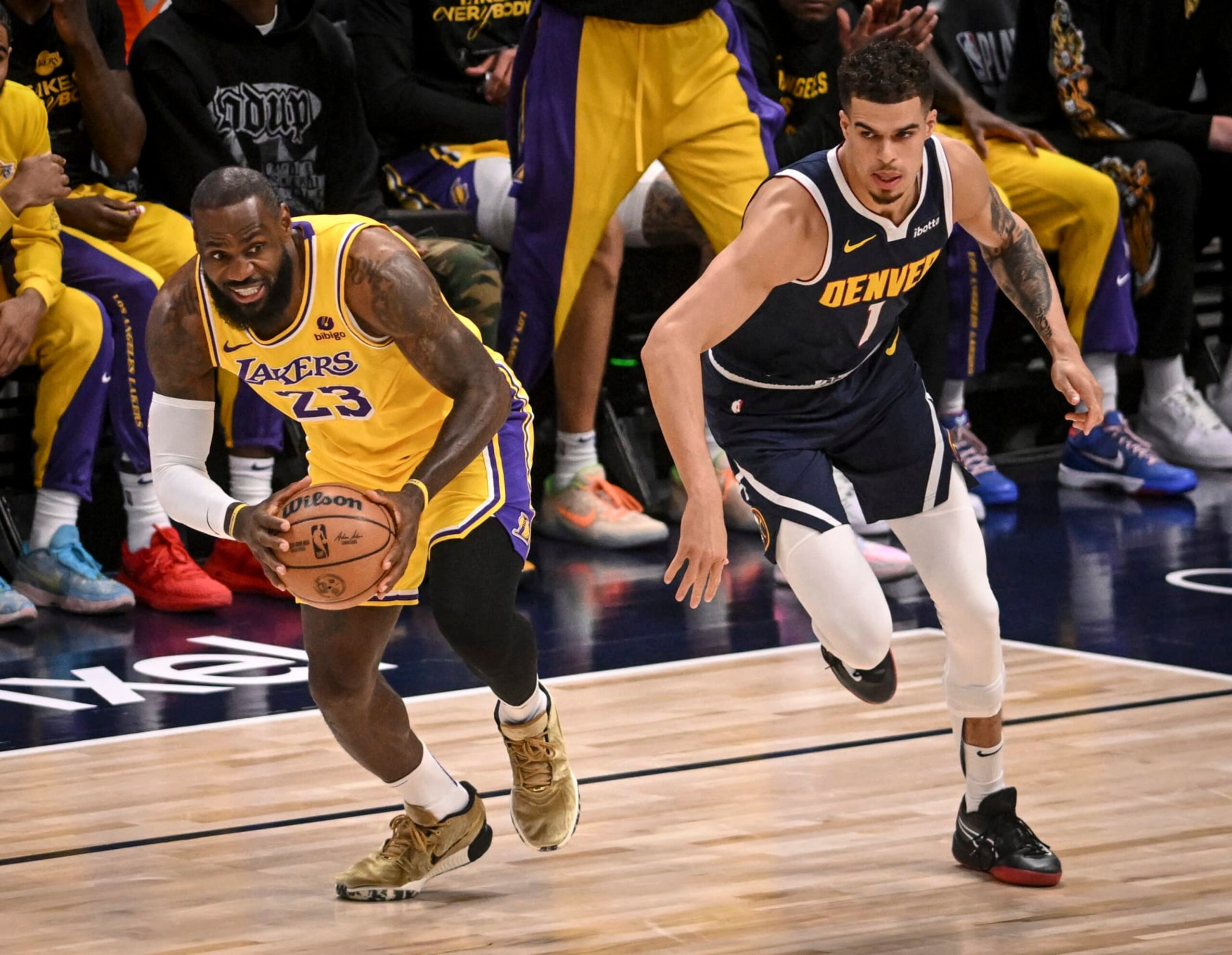 DENVER, CO - APRIL 29: LeBron James (23) of the Los Angeles Lakers steals a pass intended for Michael Porter Jr. (1) of the Denver Nuggets during the first quarter at Ball Arena in Denver, Colorado on Monday, April 29, 2024. (Photo by AAron Ontiveroz/The Denver Post)