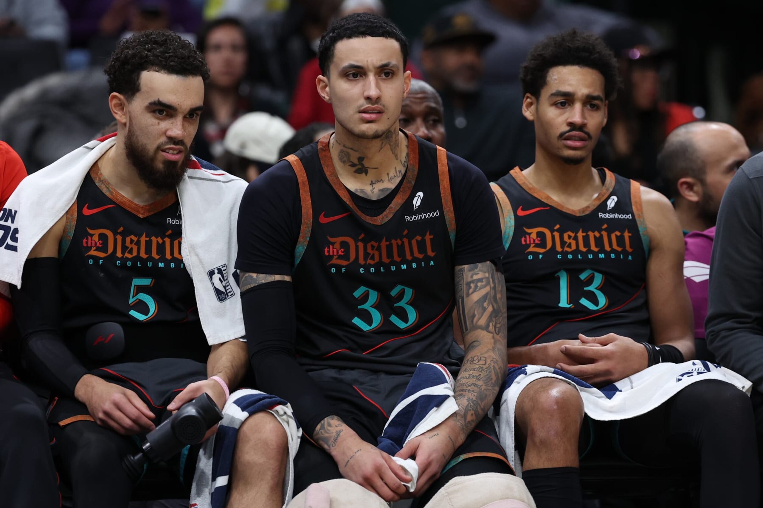 WASHINGTON, DC - FEBRUARY 02: (L-R) Tyus Jones #5, Kyle Kuzma #33, and Jordan Poole #13 of the Washington Wizards look on from the bench /H during the first half at Capital One Arena on February 2, 2024 in Washington, DC. NOTE TO USER: User expressly acknowledges and agrees that, by downloading and or using this photograph, User is consenting to the terms and conditions of the Getty Images License Agreement. (Photo by Patrick Smith/Getty Images) WASHINGTON, DC - FEBRUARY 02: (L-R) Tyus Jones #5, Kyle Kuzma #33, and Jordan Poole #13 of the Washington Wizards look on from the bench /H during the first half at Capital One Arena on February 2, 2024 in Washington, DC. NOTE TO USER: User expressly acknowledges and agrees that, by downloading and or using this photograph, User is consenting to the terms and conditions of the Getty Images License Agreement. (Photo by Patrick Smith/Getty Images)
