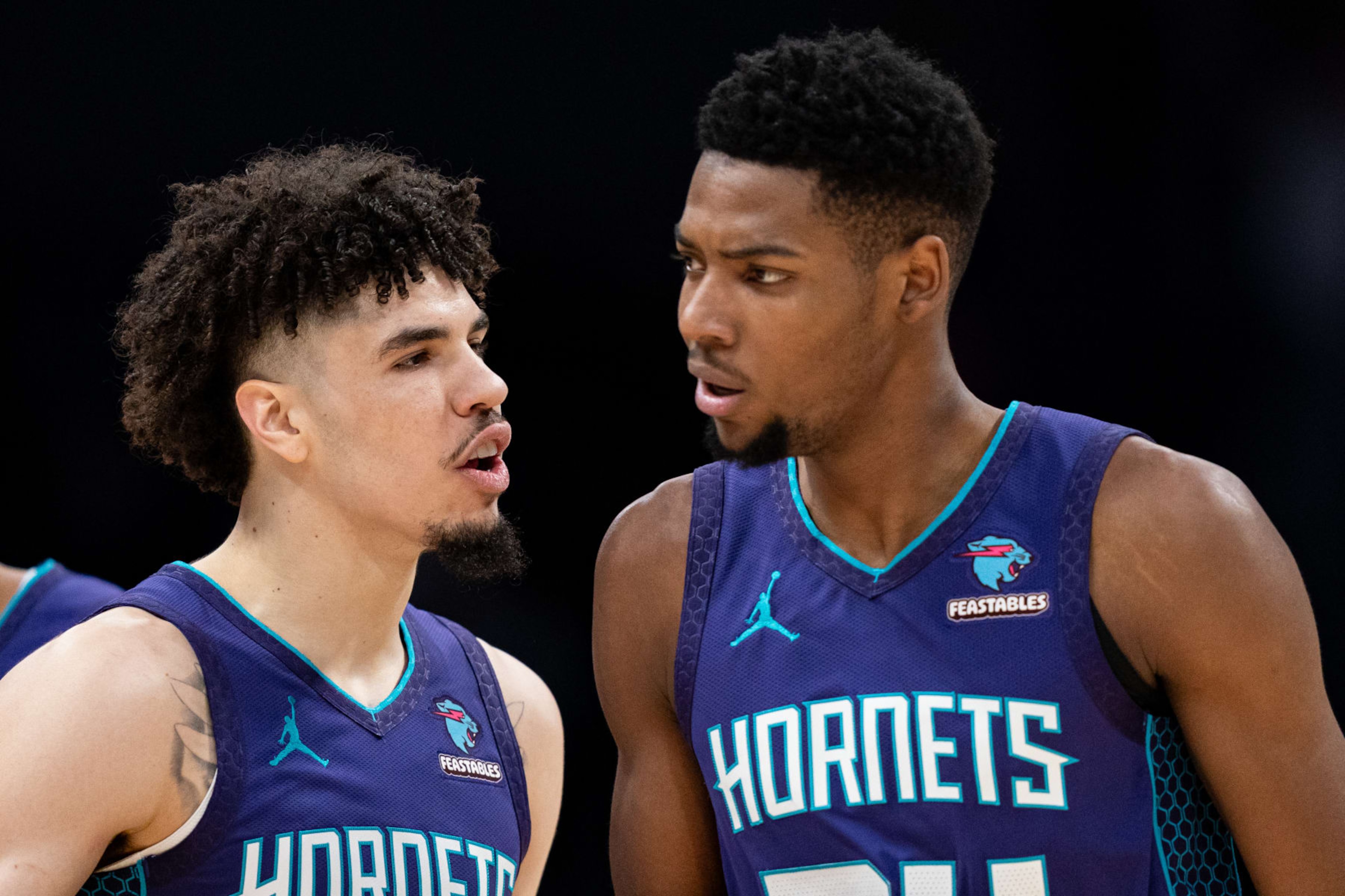 CHARLOTTE, NORTH CAROLINA - JANUARY 19: (L-R) LaMelo Ball #1 of the Charlotte Hornets reacts with Brandon Miller #24 in the first quarter during their game against the San Antonio Spurs at Spectrum Center on January 19, 2024 in Charlotte, North Carolina. NOTE TO USER: User expressly acknowledges and agrees that, by downloading and or using this photograph, User is consenting to the terms and conditions of the Getty Images License Agreement. (Photo by Jacob Kupferman/Getty Images) CHARLOTTE, NORTH CAROLINA - JANUARY 19: (L-R) LaMelo Ball #1 of the Charlotte Hornets reacts with Brandon Miller #24 in the first quarter during their game against the San Antonio Spurs at Spectrum Center on January 19, 2024 in Charlotte, North Carolina. NOTE TO USER: User expressly acknowledges and agrees that, by downloading and or using this photograph, User is consenting to the terms and conditions of the Getty Images License Agreement. (Photo by Jacob Kupferman/Getty Images)