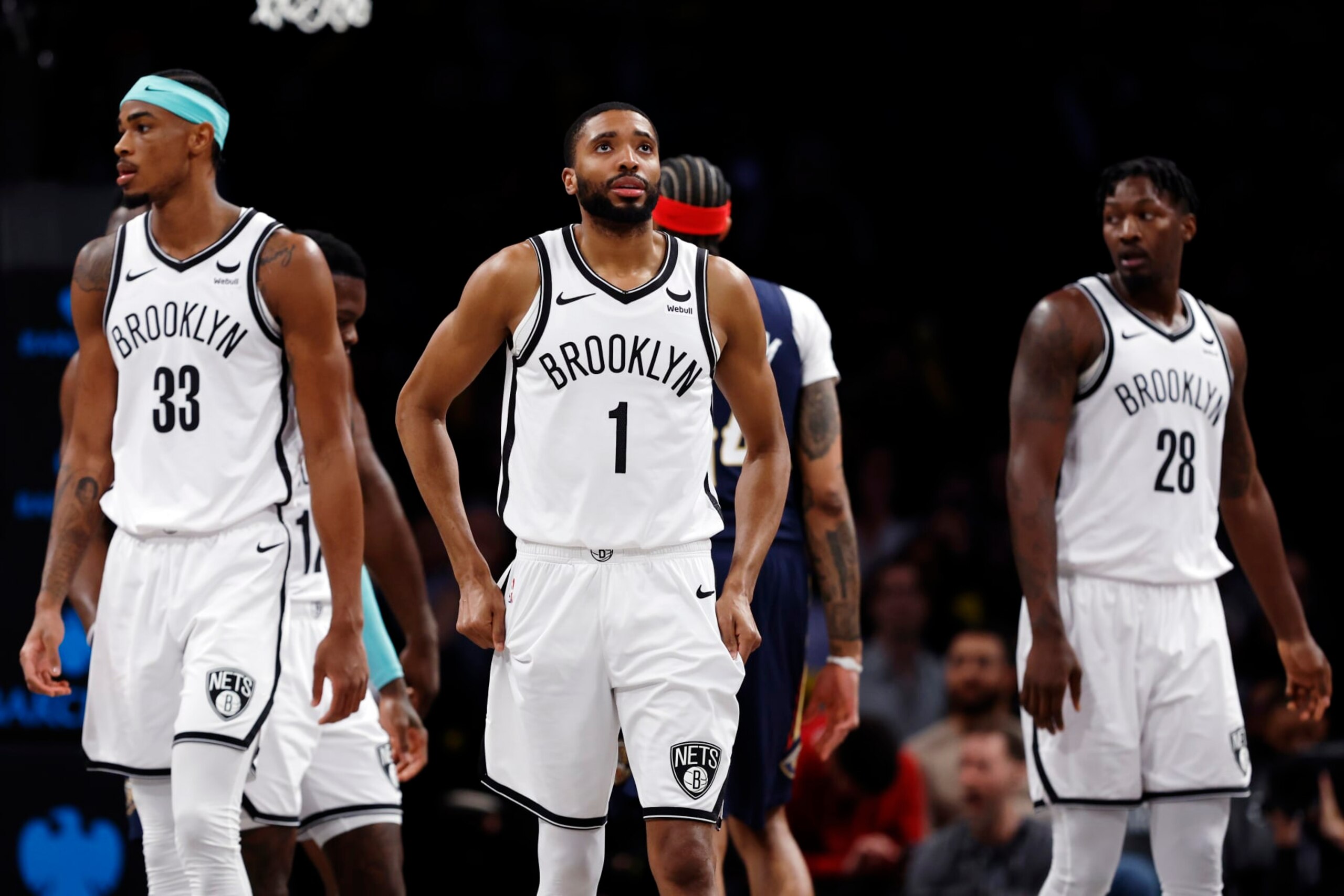 NEW YORK, NEW YORK - MARCH 19: Nic Claxton #33, Mikal Bridges #1, and Dorian Finney-Smith #28 of the Brooklyn Nets look on during the second half against the New Orleans Pelicans at Barclays Center on March 19, 2024 in the Brooklyn borough of New York City. NOTE TO USER: User expressly acknowledges and agrees that, by downloading and/or using this Photograph, user is consenting to the terms and conditions of the Getty Images License Agreement. (Photo by Sarah Stier/Getty Images) NEW YORK, NEW YORK - MARCH 19: Nic Claxton #33, Mikal Bridges #1, and Dorian Finney-Smith #28 of the Brooklyn Nets look on during the second half against the New Orleans Pelicans at Barclays Center on March 19, 2024 in the Brooklyn borough of New York City. NOTE TO USER: User expressly acknowledges and agrees that, by downloading and/or using this Photograph, user is consenting to the terms and conditions of the Getty Images License Agreement. (Photo by Sarah Stier/Getty Images)