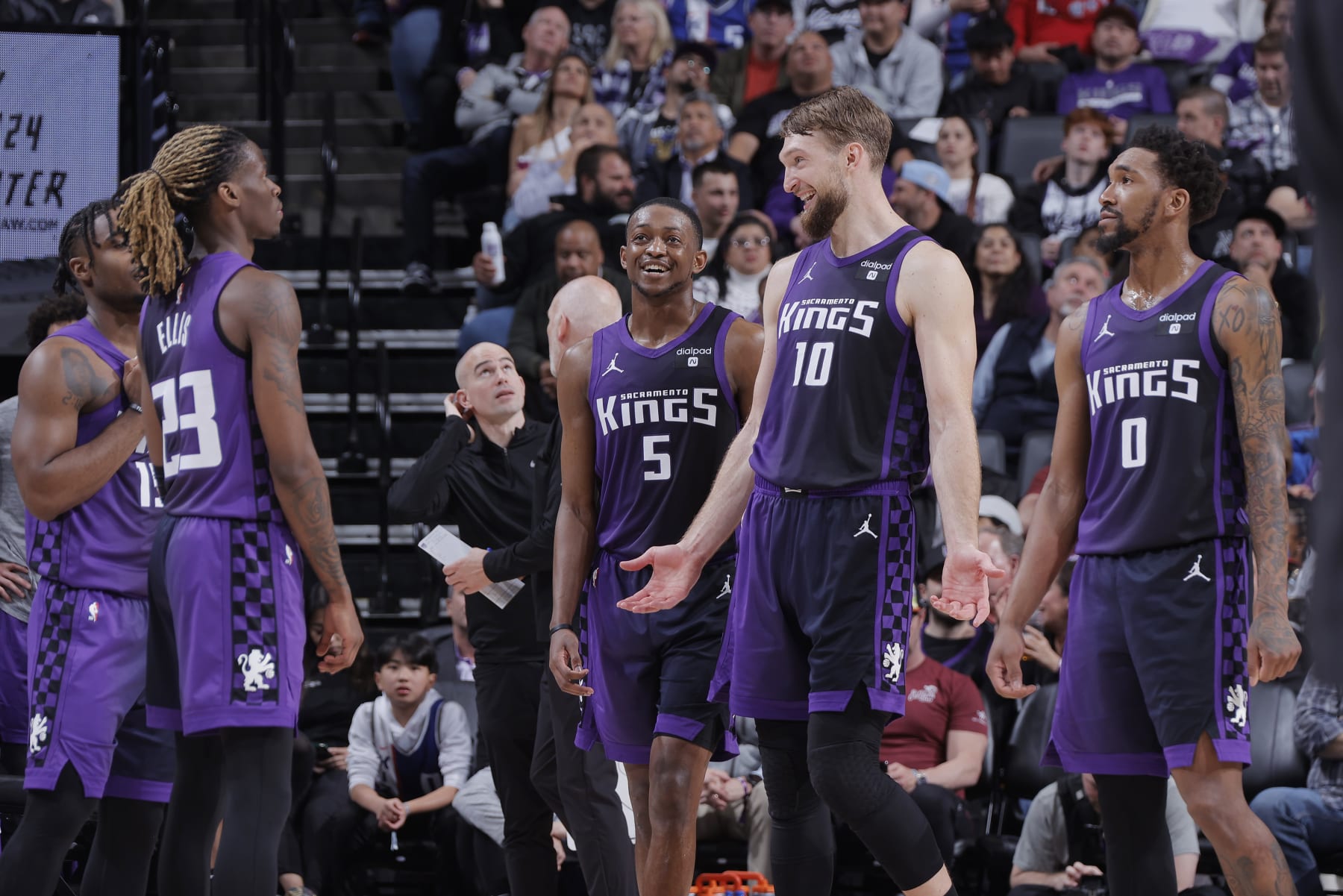 SACRAMENTO, CA - MARCH 12: Domantas Sabonis #10, De'Aaron Fox #5, Malik Monk #0, Keon Ellis #23, and Davion Mitchell #15 of the Sacramento Kings talk during the game against the Milwaukee Bucks on March 12, 2024 at Golden 1 Center in Sacramento, California. NOTE TO USER: User expressly acknowledges and agrees that, by downloading and or using this photograph, User is consenting to the terms and conditions of the Getty Images Agreement. Mandatory Copyright Notice: Copyright 2024 NBAE (Photo by Rocky Widner/NBAE via Getty Images)