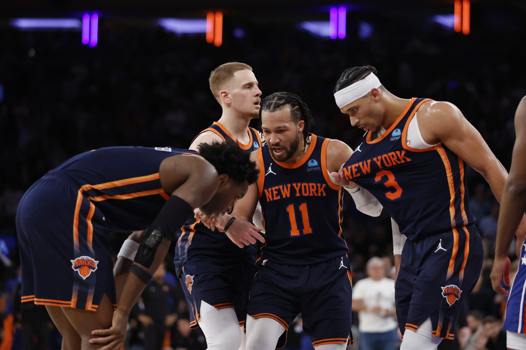 NEW YORK, NEW YORK - APRIL 22: OG Anunoby #8, Josh Hart #3, Jalen Brunson #11, and Donte DiVincenzo #0 of the New York Knicks talk during the second half against the Philadelphia 76ers in Game Two of the Eastern Conference First Round Playoffs at Madison Square Garden on April 22, 2024 in New York City. The Knicks won 104-101. NOTE TO USER: User expressly acknowledges and agrees that, by downloading and or using this photograph, User is consenting to the terms and conditions of the Getty Images License Agreement. (Photo by Sarah Stier/Getty Images)