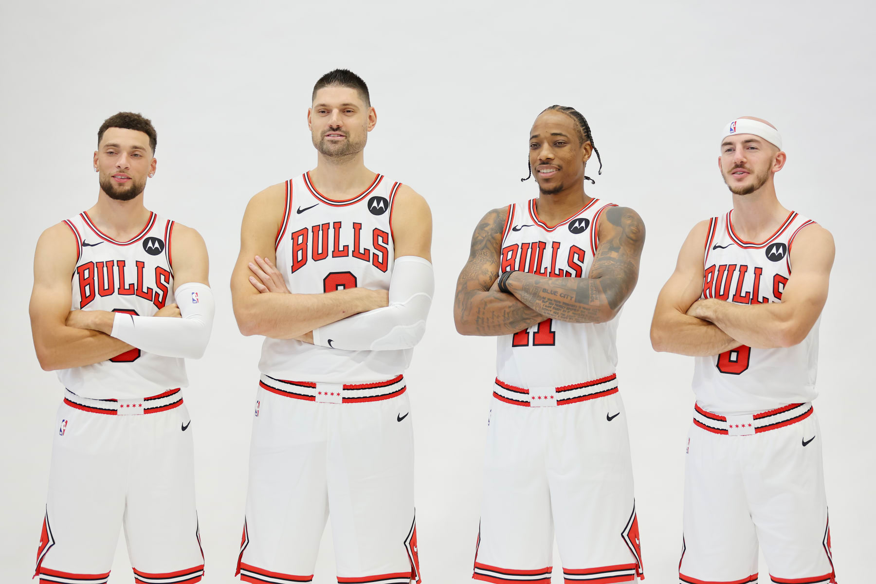 CHICAGO, ILLINOIS - OCTOBER 02: Zach LaVine #8, Nikola Vucevic #9, DeMar DeRozan #11 and Alex Caruso #6 of the Chicago Bulls pose for a photo during Media Day at Advocate Center on October 02, 2023 in Chicago, Illinois. (Photo by Michael Reaves/Getty Images)