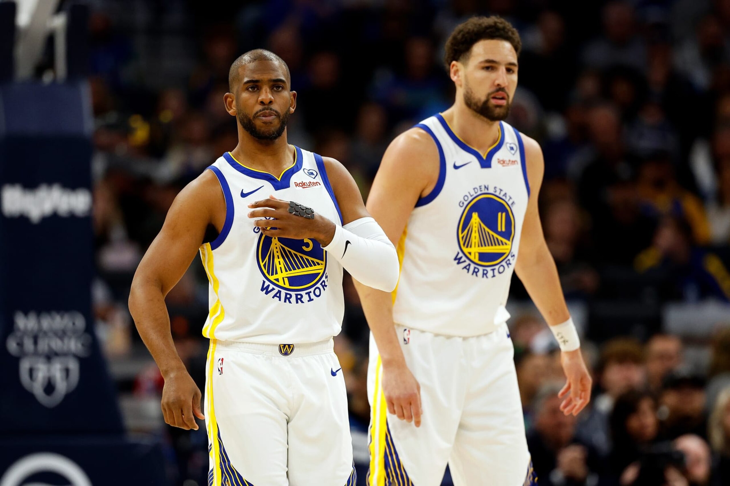 MINNEAPOLIS, MINNESOTA - MARCH 24: Chris Paul #3 and Klay Thompson #11 of the Golden State Warriors look on against the Minnesota Timberwolves in the first quarter at Target Center on March 24, 2024 in Minneapolis, Minnesota. The Timberwolves defeated the Warriors 114-110. NOTE TO USER: User expressly acknowledges and agrees that, by downloading and or using this photograph, User is consenting to the terms and conditions of the Getty Images License Agreement. (Photo by David Berding/Getty Images)