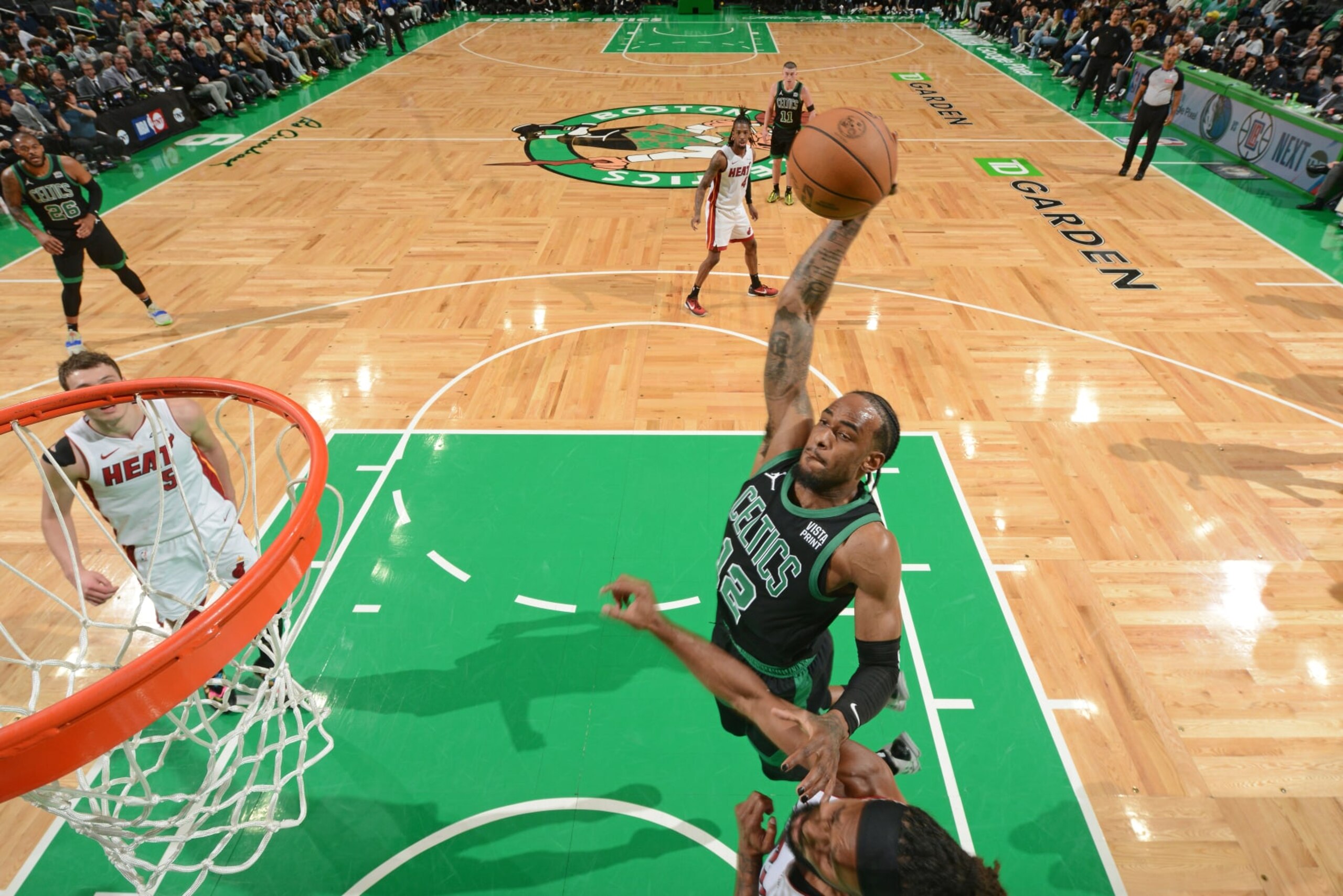 BOSTON, MA - MAY 1: Oshae Brissett #12 of the Boston Celtics drives to the basket during the game against the Miami Heat during Round 1 Game 5 of the 2024 NBA Playoffs on May 1, 2024 at the TD Garden in Boston, Massachusetts. NOTE TO USER: User expressly acknowledges and agrees that, by downloading and or using this photograph, User is consenting to the terms and conditions of the Getty Images License Agreement. Mandatory Copyright Notice: Copyright 2024 NBAE  (Photo by Brian Babineau/NBAE via Getty Images)