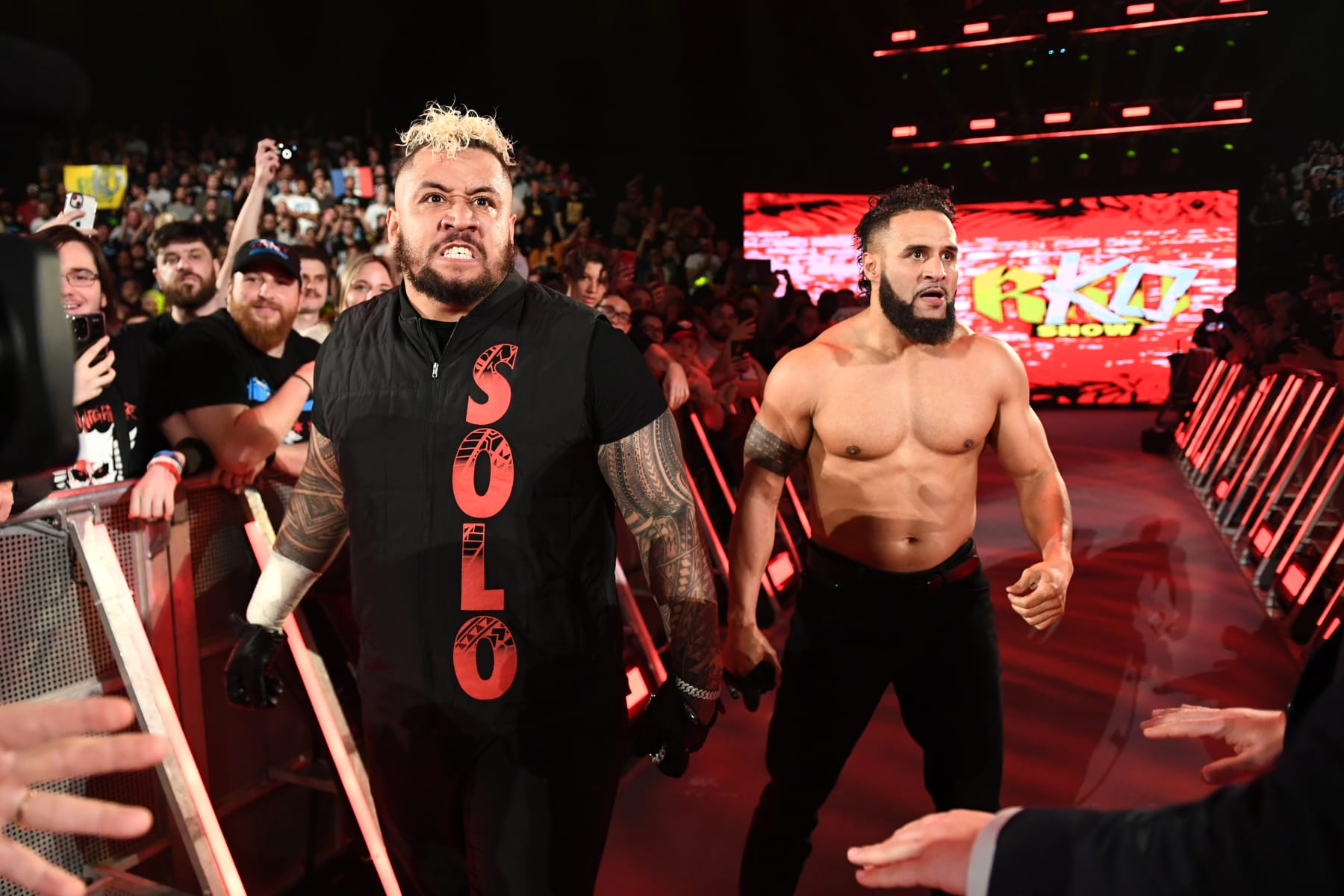 LYON, FRANCE - MAY 03: (L-R) Solo Sikoa and Tara Tonga react during SmackDown at LDLC Arena on May 3, 2024 in Lyon, France.  (Photo by WWE/Getty Images)