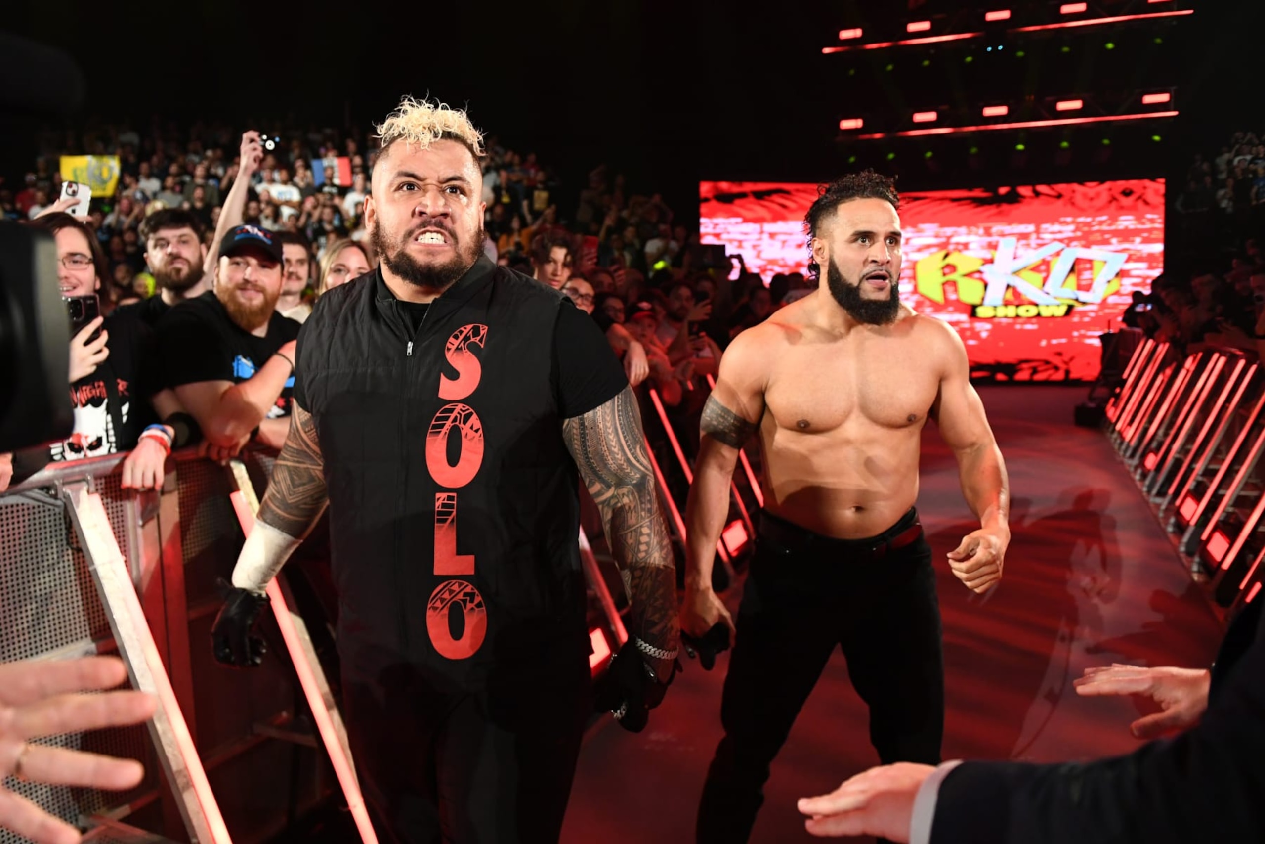 LYON, FRANCE - MAY 03: (L-R) Solo Sikoa and Tara Tonga react during SmackDown at LDLC Arena on May 3, 2024 in Lyon, France.  (Photo by WWE/Getty Images)