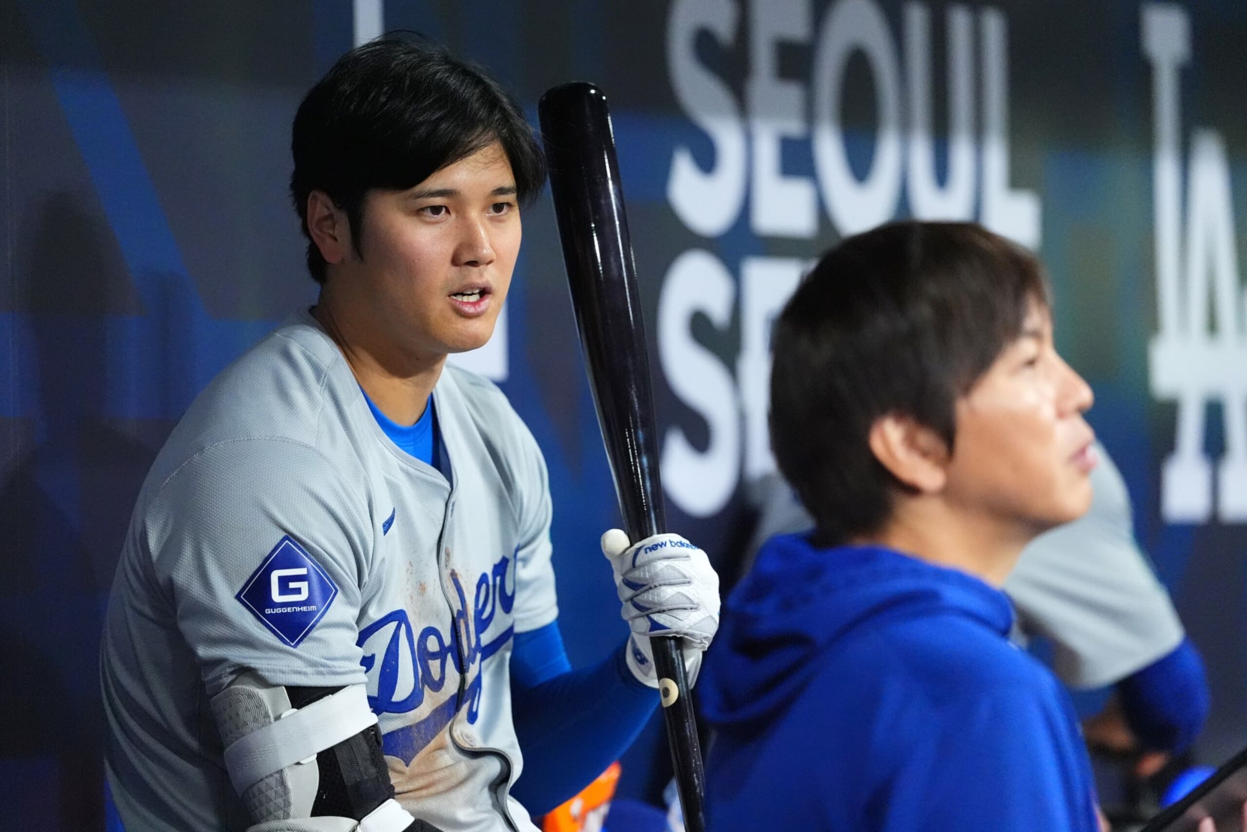 SEOUL, SOUTH KOREA - MARCH 20: Shohei Ohtani #17 of the Los Angeles Dodgers talks to his interpreter Ippei Mizuhara in the dugout during the 2024 Seoul Series game between Los Angeles Dodgers and San Diego Padres at Gocheok Sky Dome on March 20, 2024 in Seoul, South Korea. (Photo by Masterpress/Getty Images)