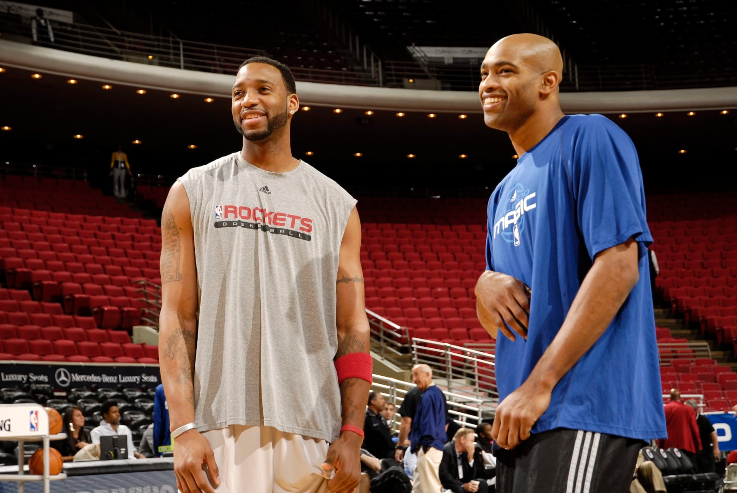 ORLANDO, FL - DECEMBER 23:  Cousins Tracy McGrady #3 of the Houston Rockets and Vince Carter #15 of the Orlando Magic chat before the game on December 23, 2009 at Amway Arena in Orlando, Florida. NOTE TO USER: User expressly acknowledges and agrees that, by downloading and or using this photograph, User is consenting to the terms and conditions of the Getty Images License Agreement. Mandatory Copyright Notice: Copyright 2009 NBAE  (Photo by Fernando Medina/NBAE via Getty Images)