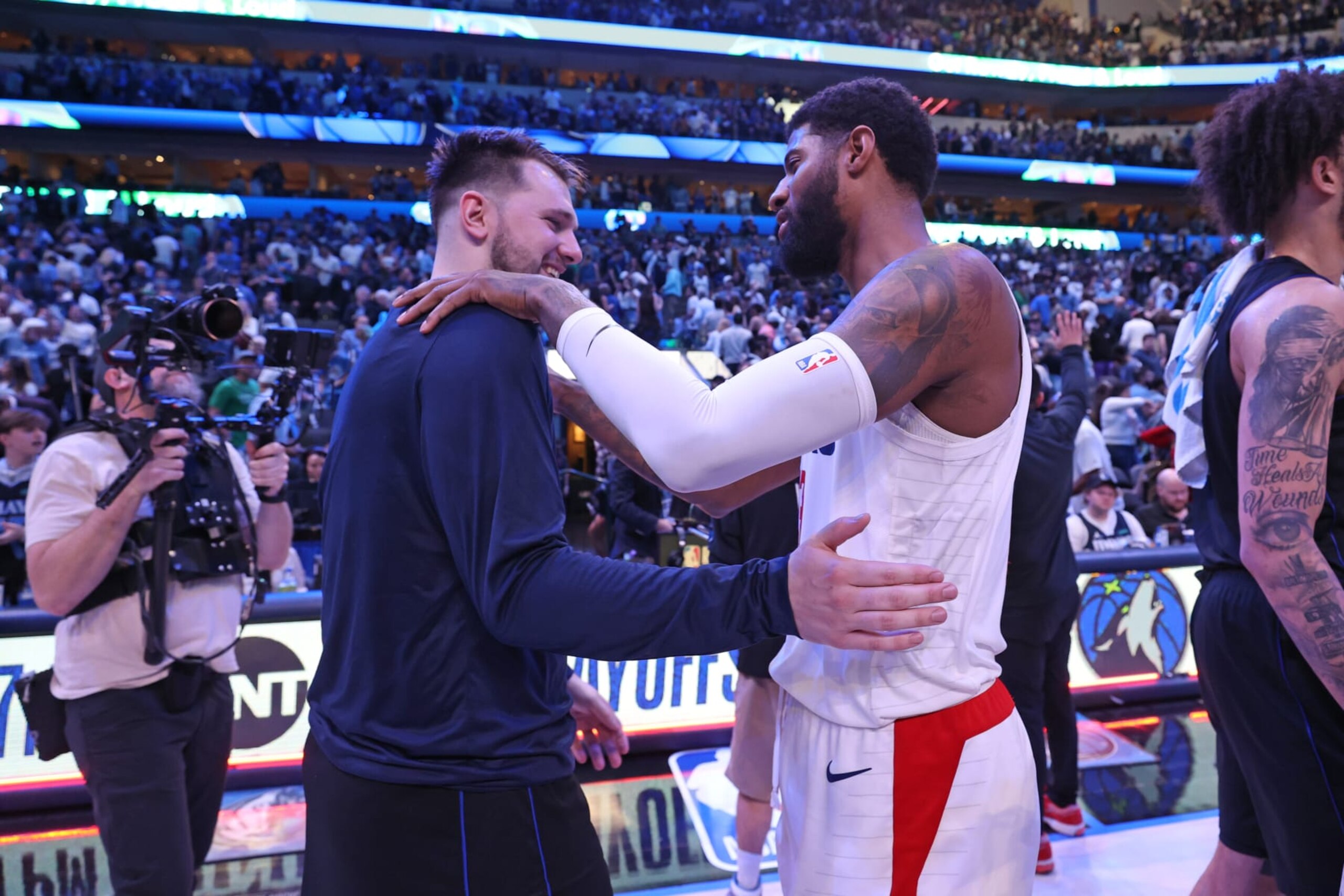 DALLAS, TX - MAY 3: Luka Doncic #77 of the Dallas Mavericks greets Paul George #13 of the LA Clippers after the game during Round 1 Game 6 of the 2024 NBA Playoffs on May 3, 2024 at the American Airlines Center in Dallas, Texas. NOTE TO USER: User expressly acknowledges and agrees that, by downloading and or using this photograph, User is consenting to the terms and conditions of the Getty Images License Agreement. Mandatory Copyright Notice: Copyright 2024 NBAE (Photo by Joe Murphy/NBAE via Getty Images)