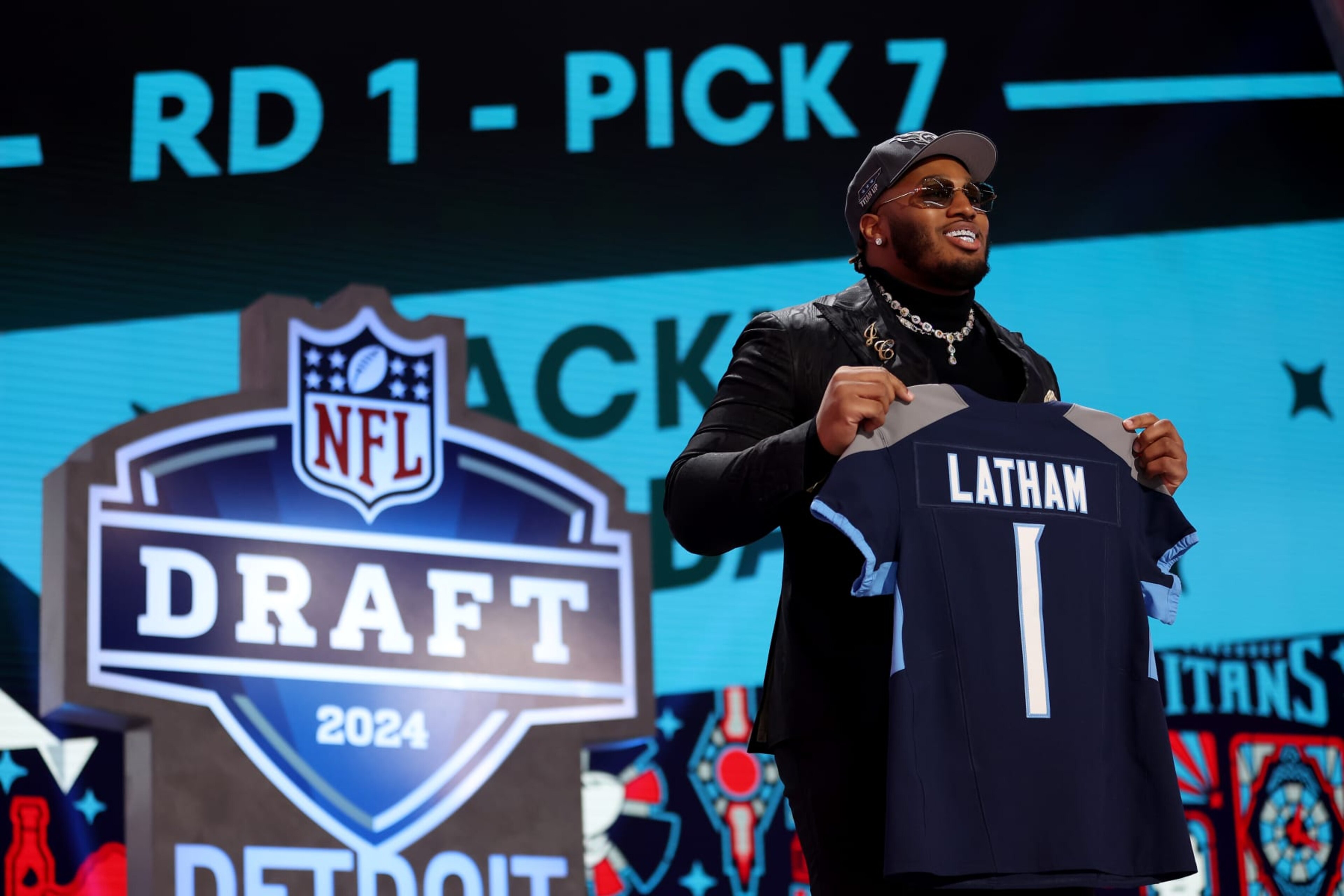 DETROIT, MICHIGAN - APRIL 25: JC Latham celebrates after being selected seventh overall by the Tennessee Titans during the first round of the 2024 NFL Draft at Campus Martius Park and Hart Plaza on April 25, 2024 in Detroit, Michigan. (Photo by Gregory Shamus/Getty Images) DETROIT, MICHIGAN - APRIL 25: JC Latham celebrates after being selected seventh overall by the Tennessee Titans during the first round of the 2024 NFL Draft at Campus Martius Park and Hart Plaza on April 25, 2024 in Detroit, Michigan. (Photo by Gregory Shamus/Getty Images)